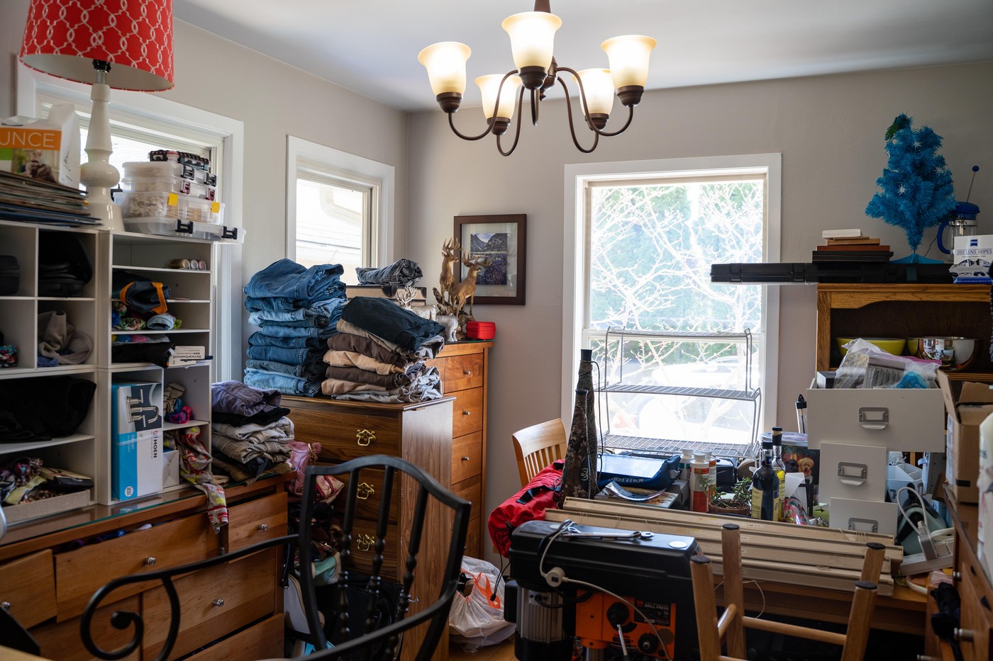 Minneapolis, Minnesota - April 24, 2019: Overcrowded residential kitchen in a home filled with junk. Concept for hoarding house, messy home, remodelin
