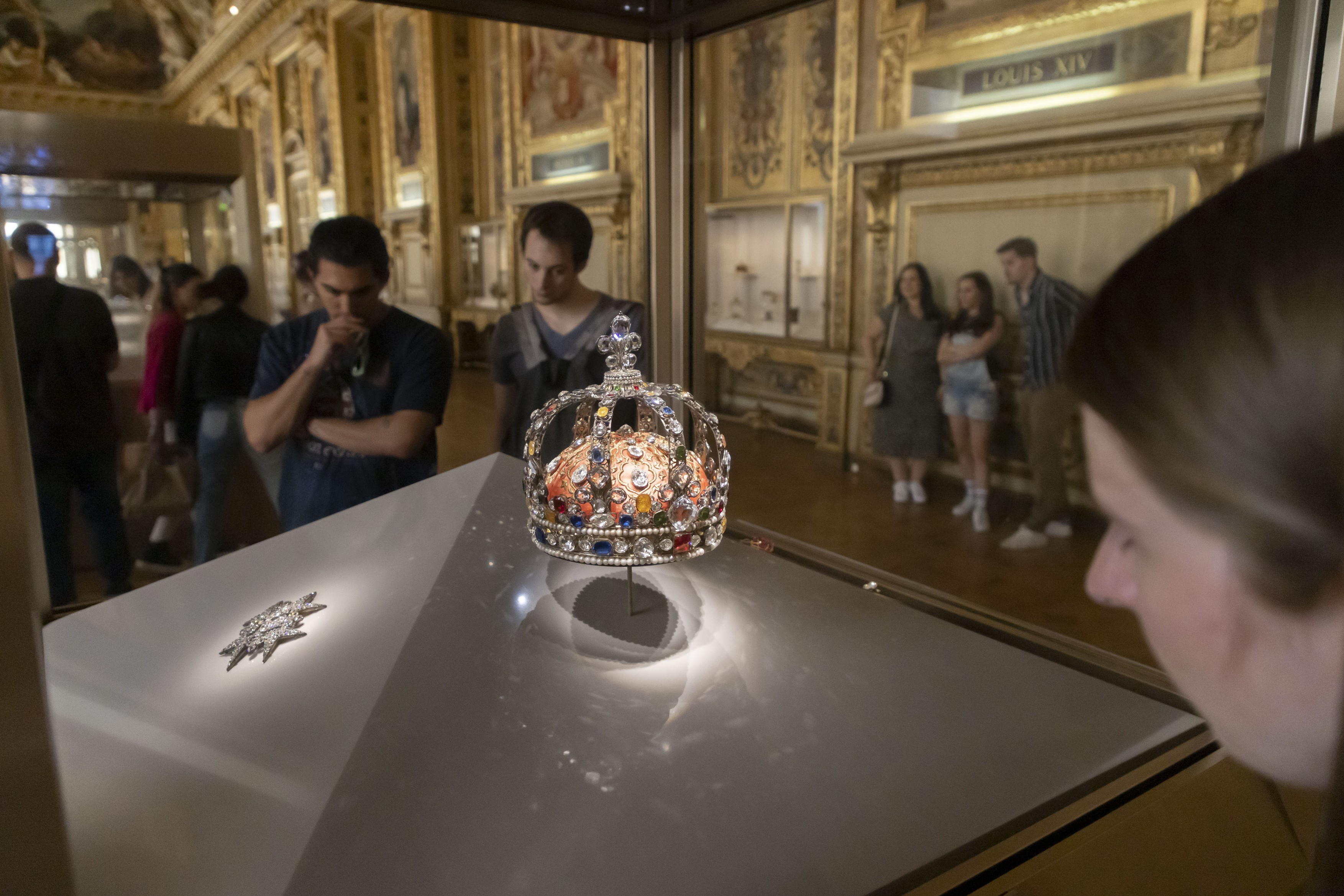 Tourists visit the famous Parisian museum Musee Du Louvre.