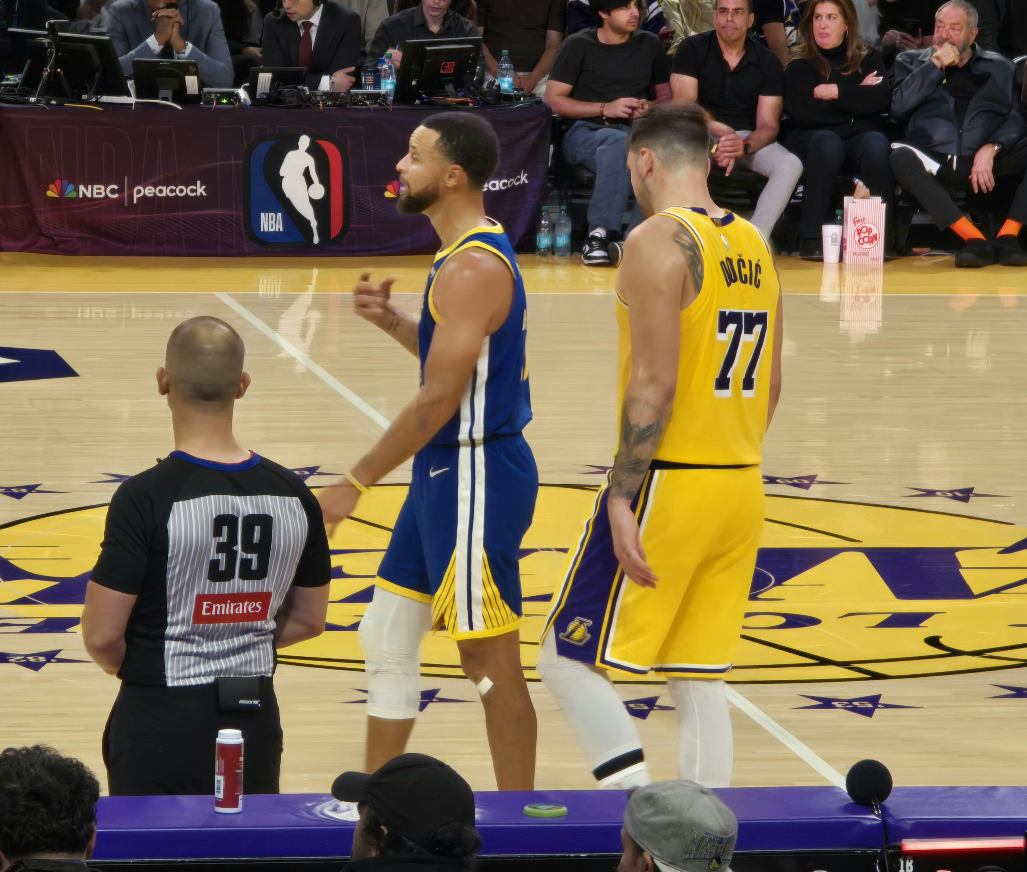 Luka Doncic shows off his latest tattoos as he plays against Steph Curry during NBA opening night Lakers vs. Warriors in LA