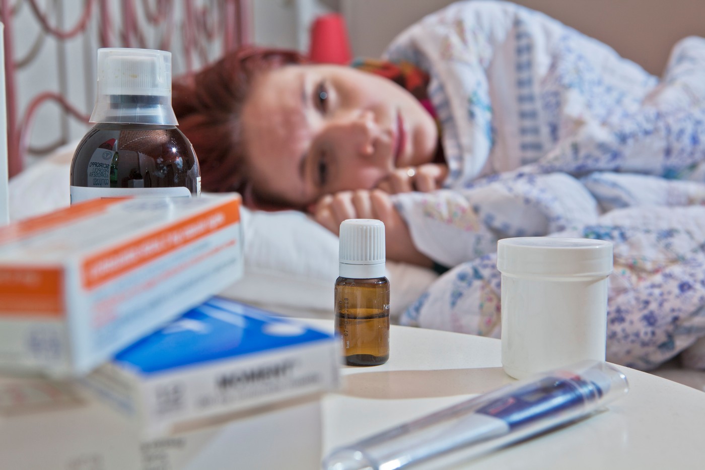 woman in bed with the flu