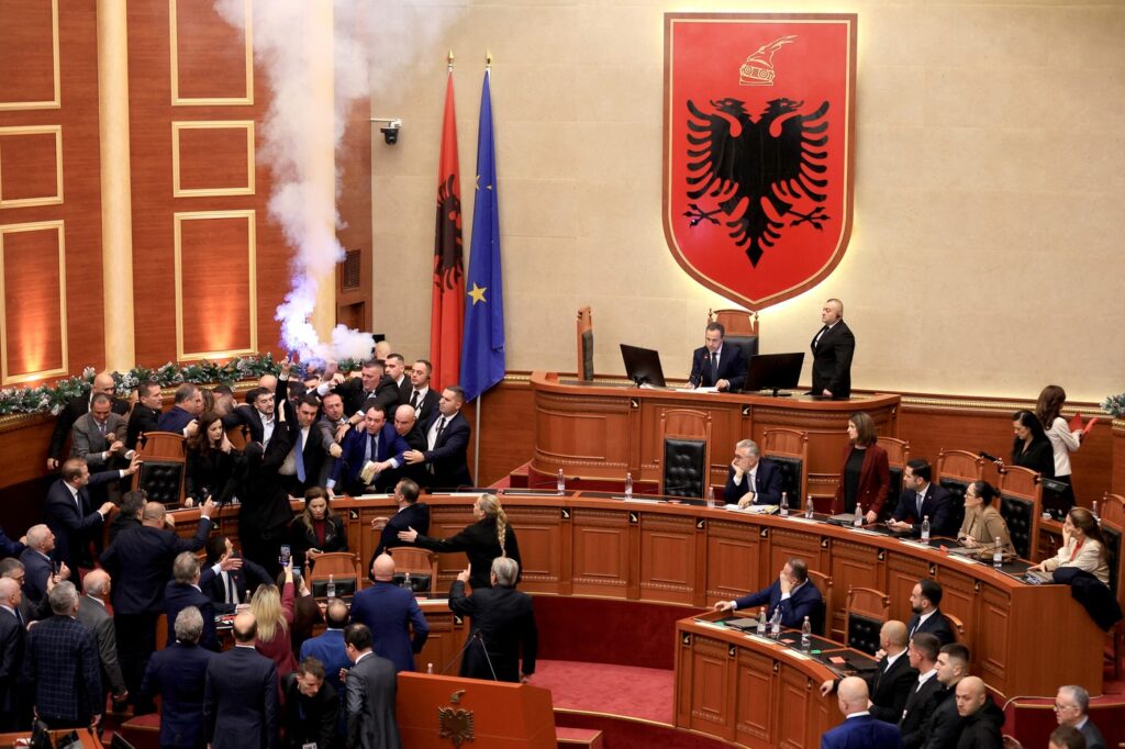 An Albanian opposition MP (Centre L) holds a flare during a parliamentary session in Tirana on December 18, 2025.,Image: 1060131675, License: Rights-managed, Restrictions: , Model Release: no, Credit line: Adnan Beci / AFP / Profimedia