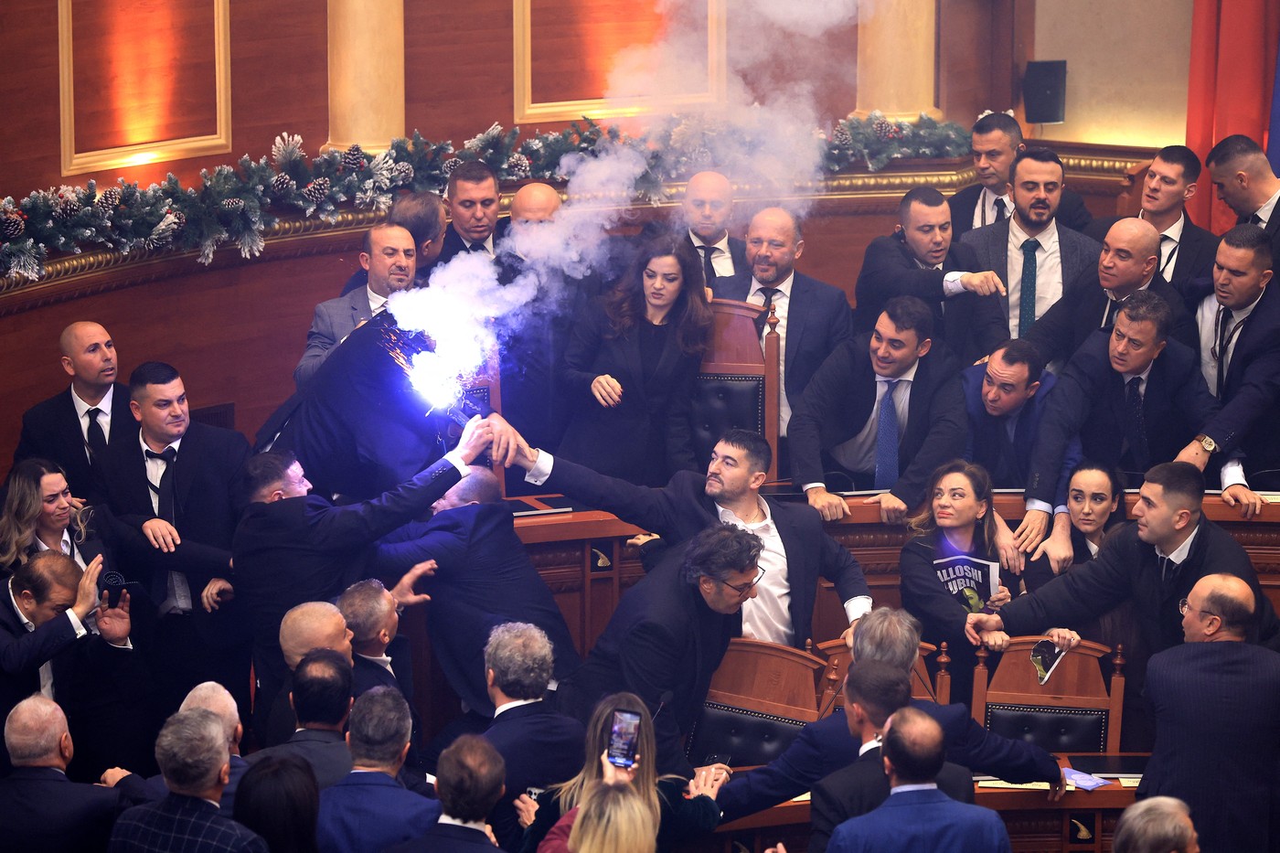 An Albanian opposition MP (C) holds a flare during a parliamentary session in Tirana on December 18, 2025.,Image: 1060131676, License: Rights-managed, Restrictions: , Model Release: no, Credit line: Adnan Beci / AFP / Profimedia