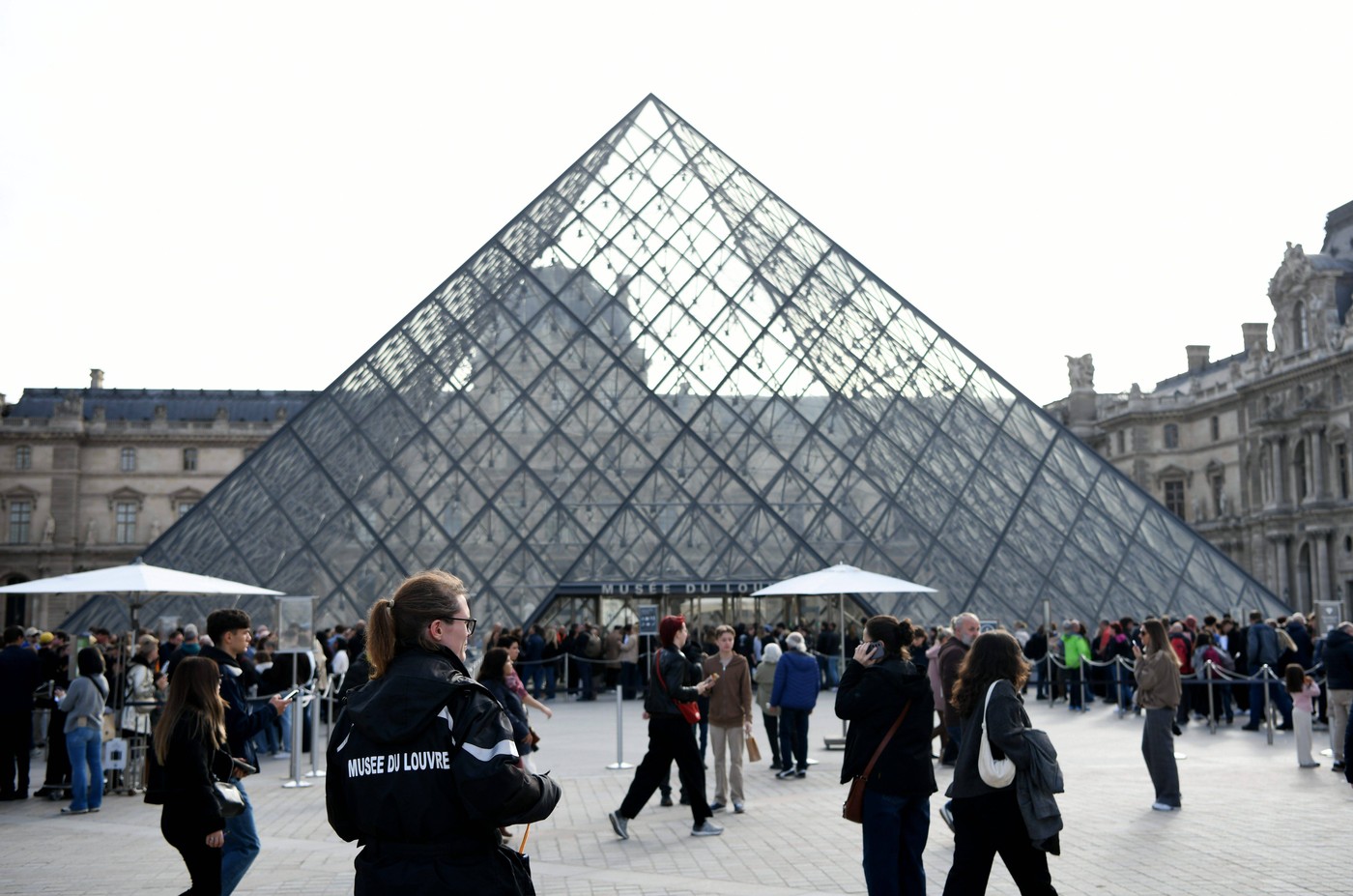 PARIS, FRANCE - OCTOBER 22: Visitors queue up outside the Louvre Museum on October 22, 2025 in Paris, France. The Louvre