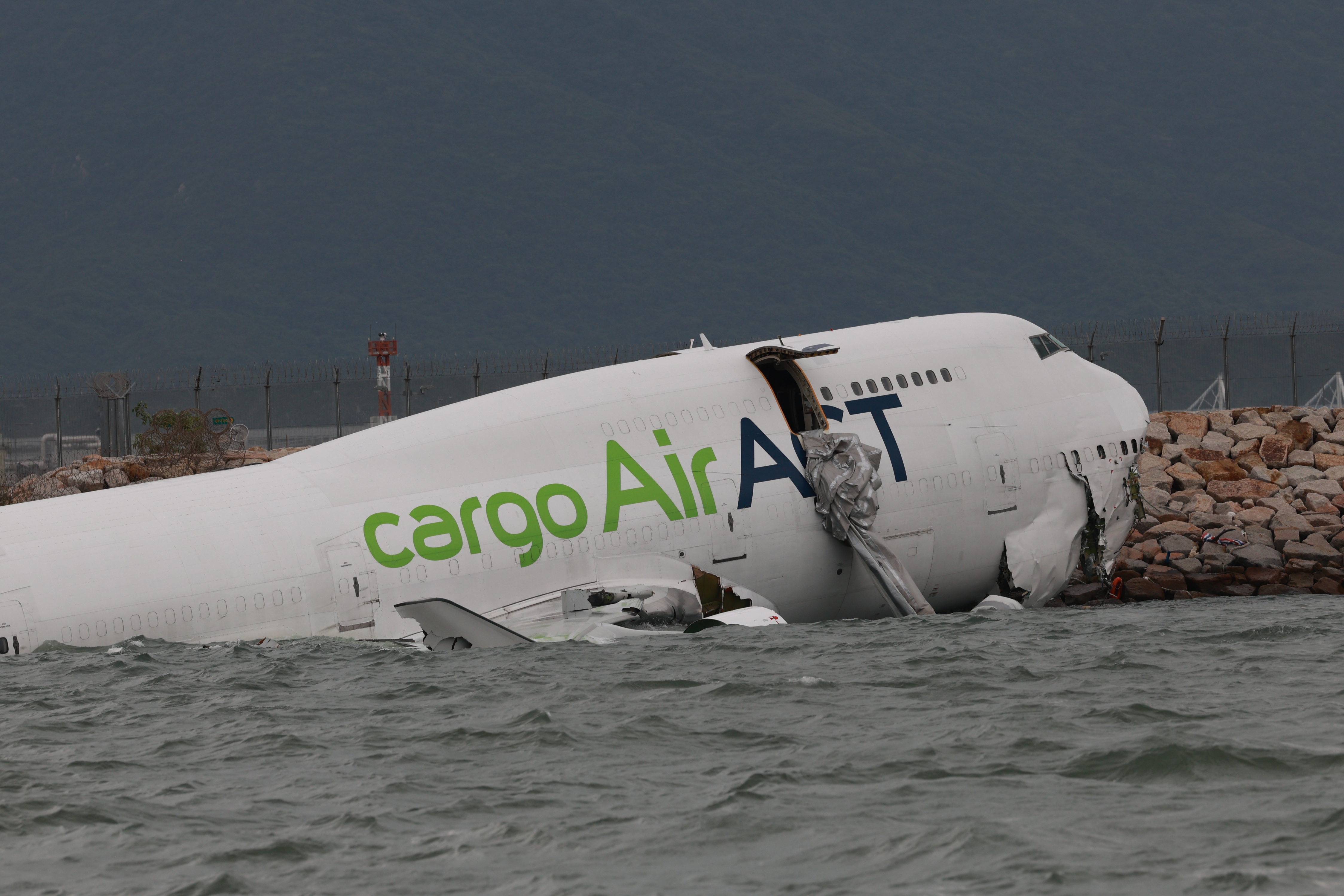Cargo airplane skids off the runway at Hong Kong International Airport
