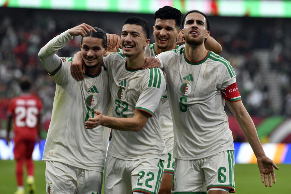 epa12619530 Ibrahim Maza of Algeria (C) celebrates with teammates after scoring the 0-3 goal during the CAF Africa Cup of Nations 2025 group stage match between Equatorial Guinea and Algeria in Rabat, Morocco, 31 December 2025.  EPA/JALAL MORCHIDI