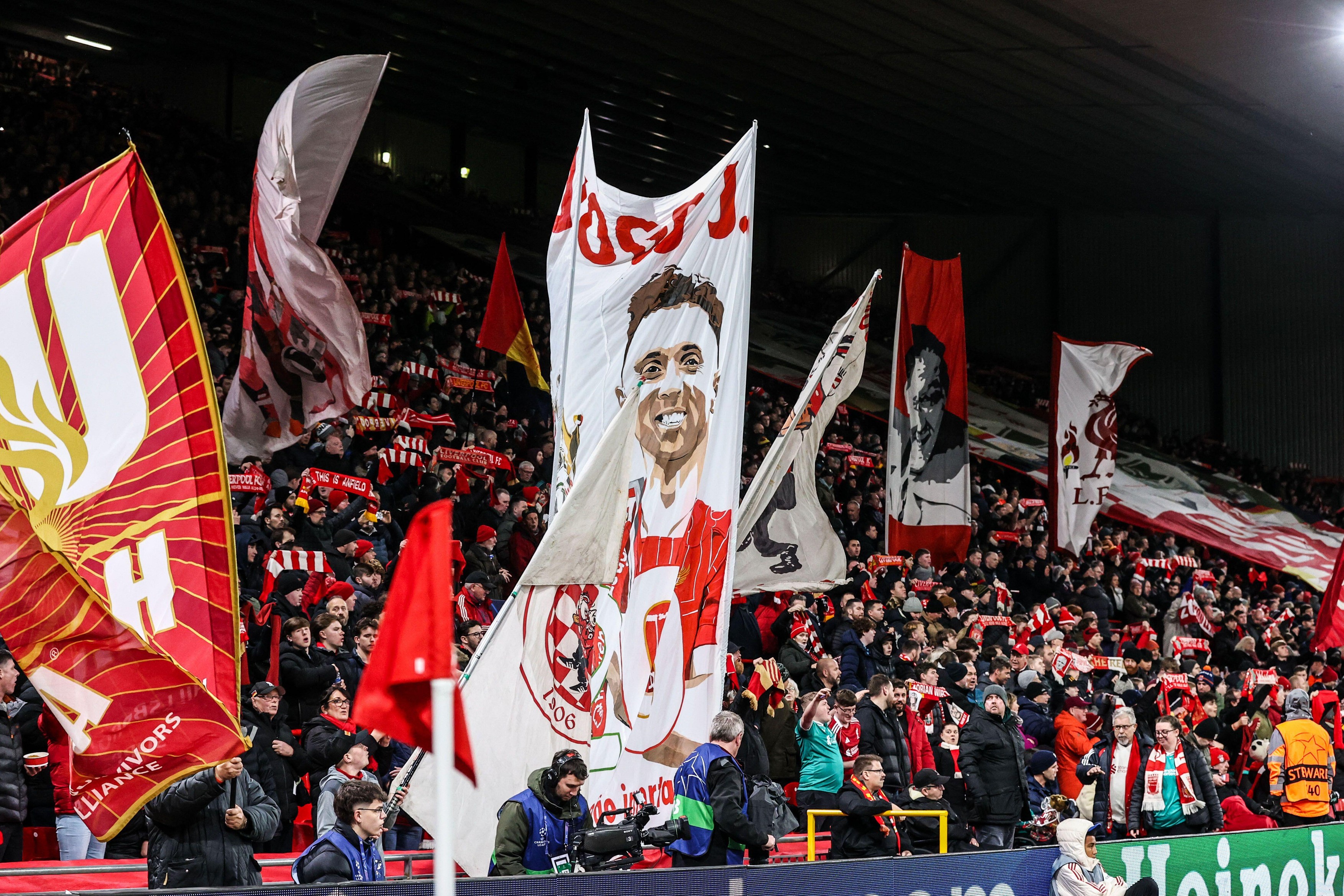 Liverpool fans wave a Diogo Jota flag as they sing ‘You’ll Never Walk Alone’ before the game during the UEFA Champions League Matchday 5 of 8 Liverpool vs PSV Eindhoven at Anfield, Liverpool, United Kingdom, 26th November 2025  (Photo by Alfie Cosgrove/Ne