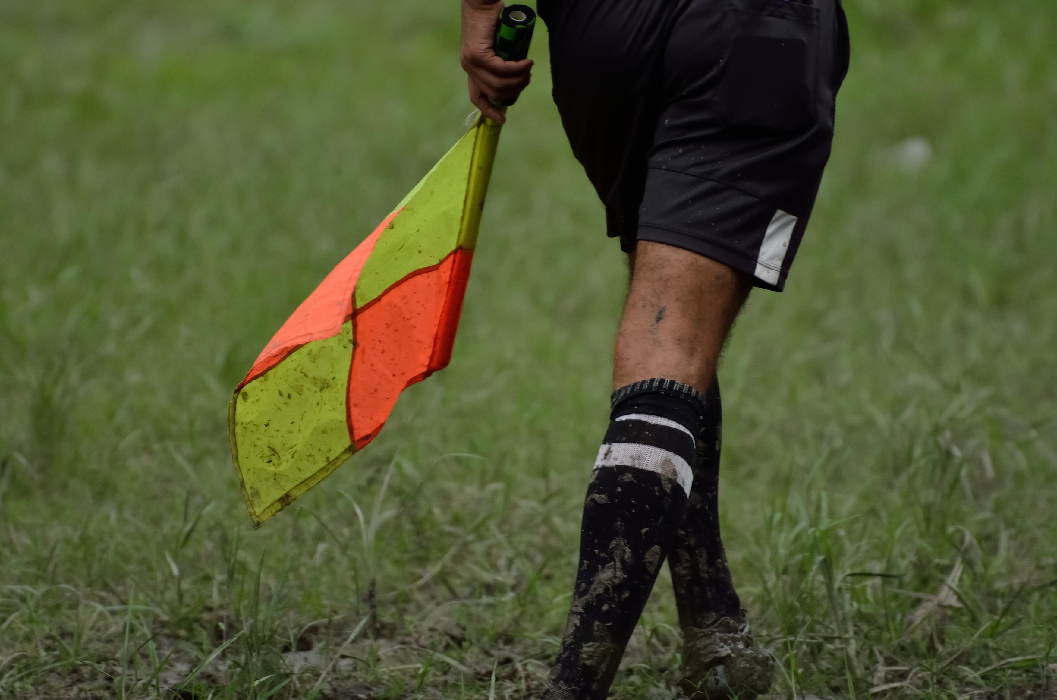 Soccer assistant referee running with flag.,Image: 259016390, License: Royalty-free, Restrictions: , Model Release: no, Credit line: Suman Bhaumik / Alamy / Profimedia