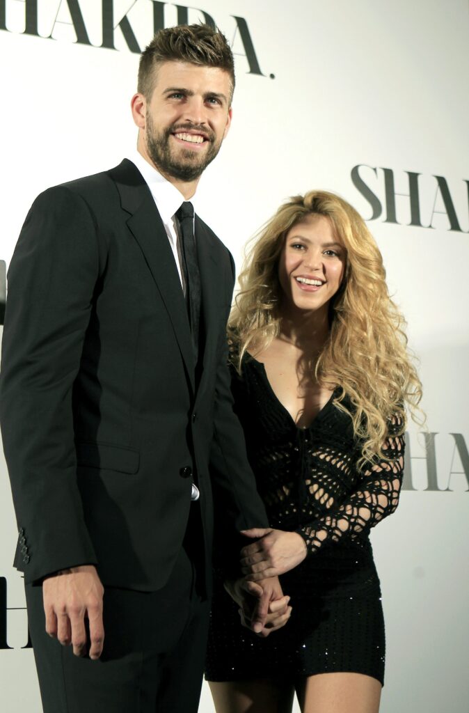 epa04134244 Colombiana singer Shakira (R) poses for the media with his boyfriend FC Barcelona's defender Gerard Pique (L) during the presentation of her last album 'Shakira' in Barcelona, northeastern Spain, 20 March 2014.  EPA/ANDREU DALMAU