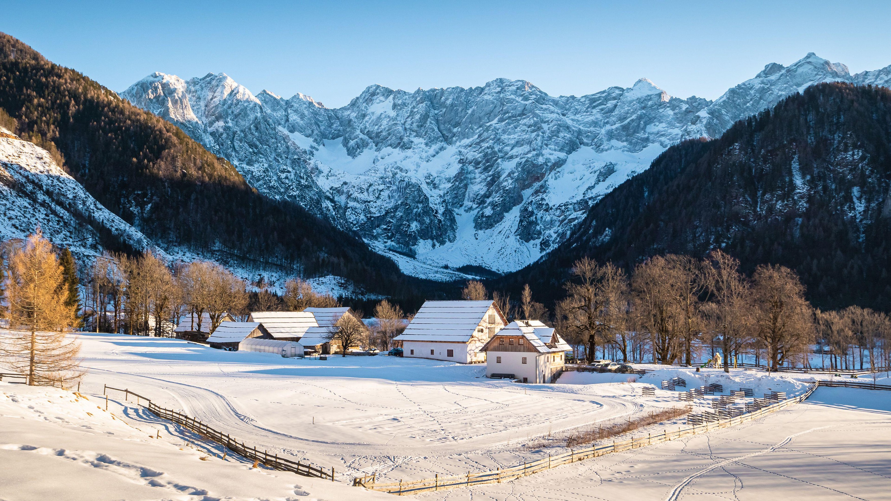 The panoramic view of mountain village Zgornje Jezersko, Slovenia, settled in the Alpine foothills. Winter snowy scene on a sunny day.