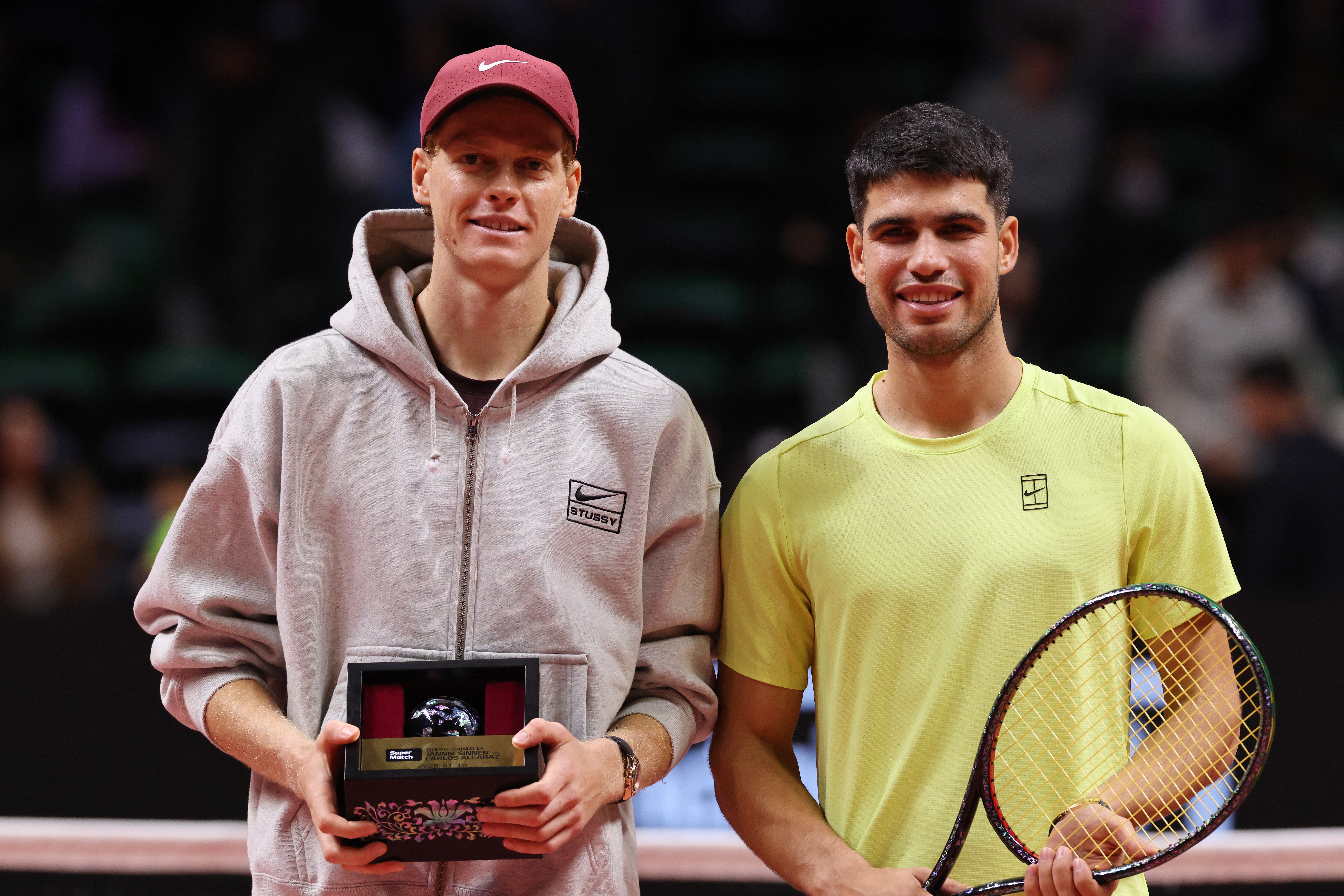 epa12640097 Jannik Sinner (L) of Italy and Carlos Alcaraz of Spain pose for photos after Alcaraz won the Hyundai Card Super Match in Incheon, South Korea, 10 January 2026.  EPA/HAN MYUNG-GU
