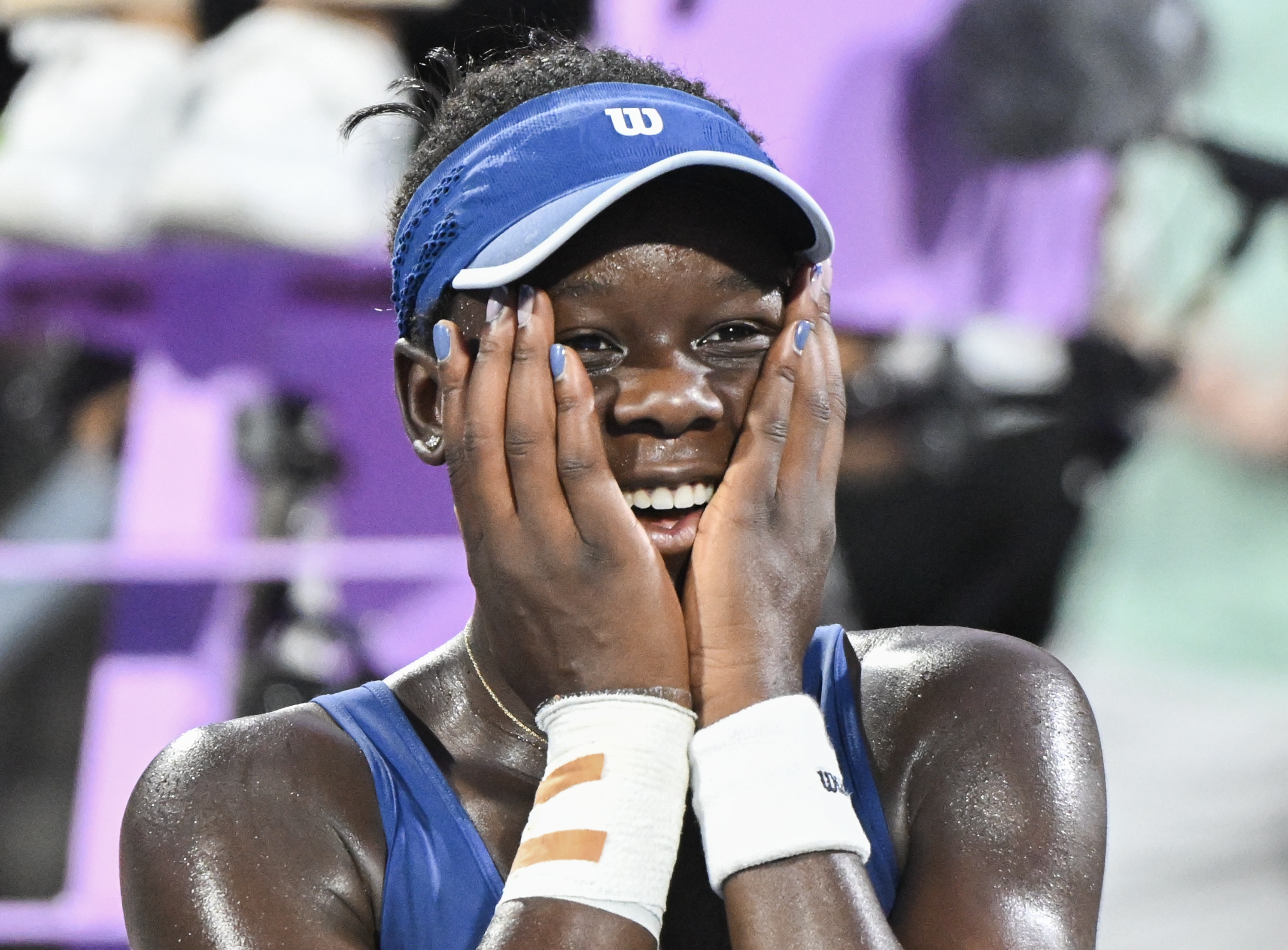 epaselect epa12289125 Victoria Mboko of Canada reacts after defeating Naomi Osaka of Japan to win the National Bank Open at IGA Stadium in Montreal, Canada, 07 August 2025.  EPA/GRAHAM HIUGHES