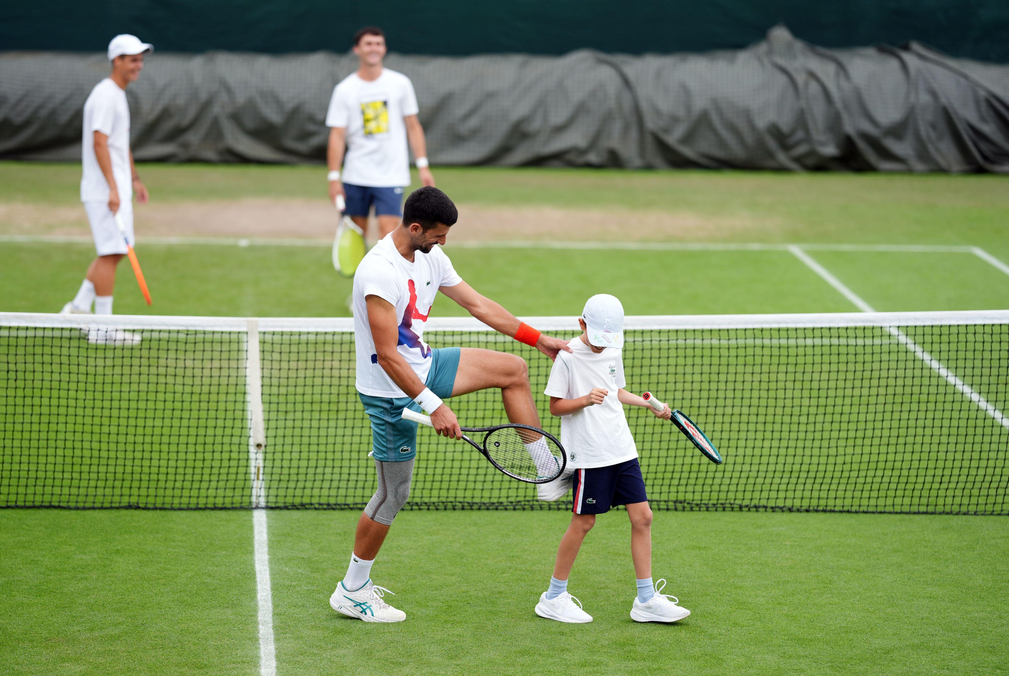 Novak Djokovic with his son Stefan, on day ten of the 2024 Wimbledon Championships at the All England Lawn Tennis and Croquet Club, London. Picture date: Wednesday July 10, 2024.