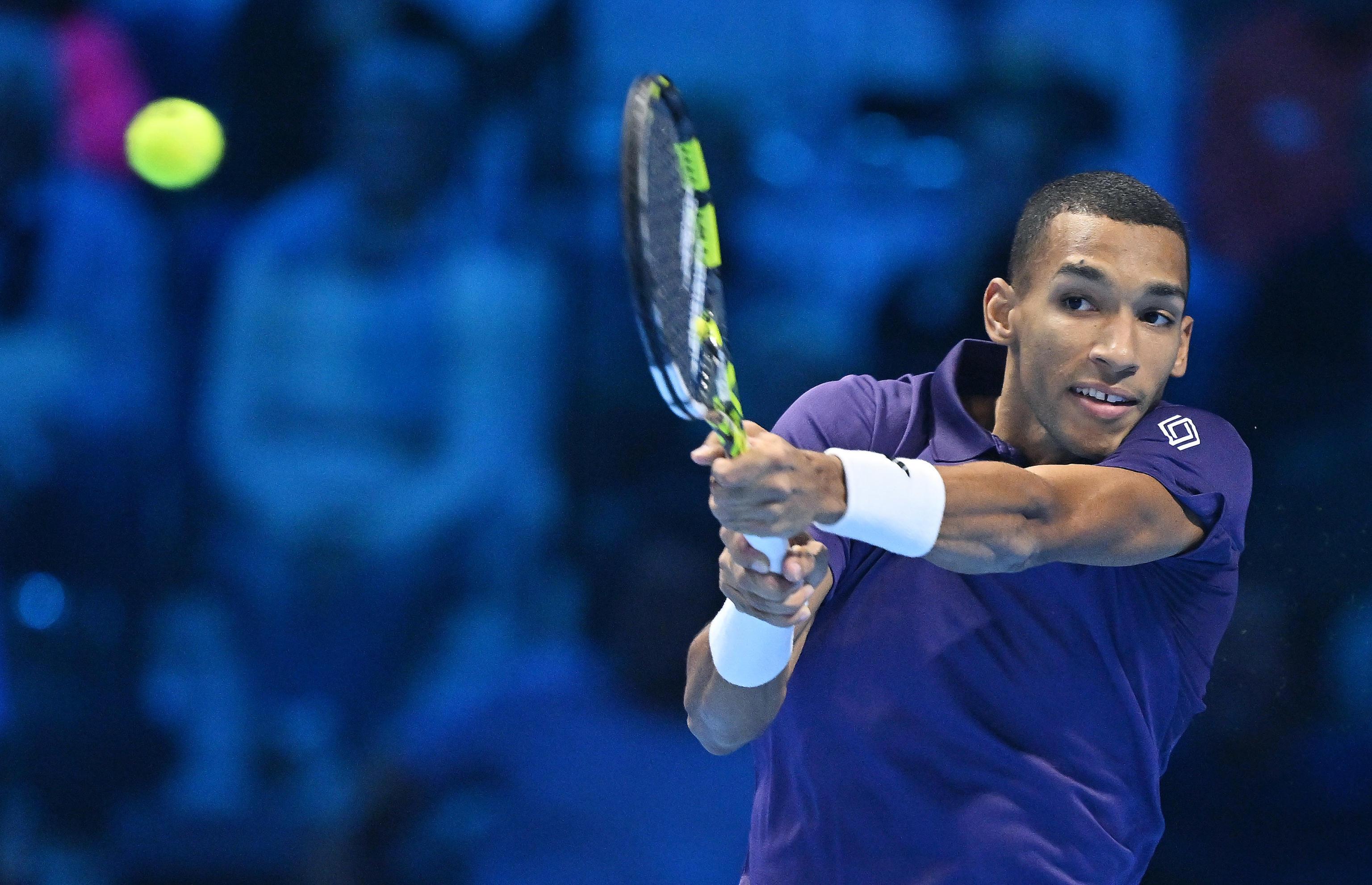 epa12520570 Felix Auger-Aliassime of Canada in action during the singles Round Robin match against Ben Shelton of USA at the ATP Finals in Turin, Italy, 12 November 2025.  EPA/ALESSANDRO DI MARCO