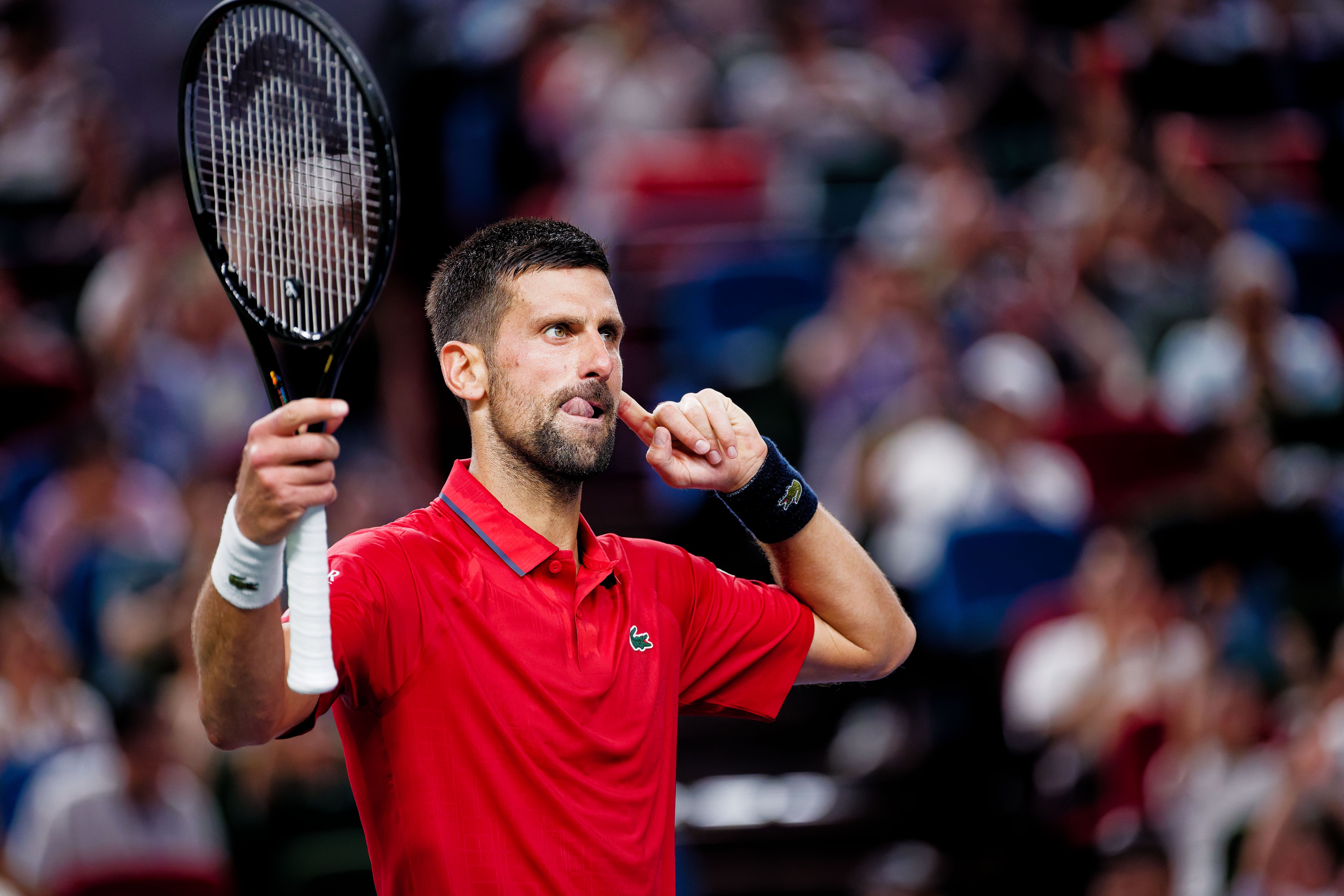 epa12432498 Novak Djokovic of Serbia reacts during his Men's Singles match against Yannick Hanfmann of Germany at the Shanghai Masters tennis tournament in Shanghai, China, 05 October 2025.  EPA/ALEX PLAVEVSKI