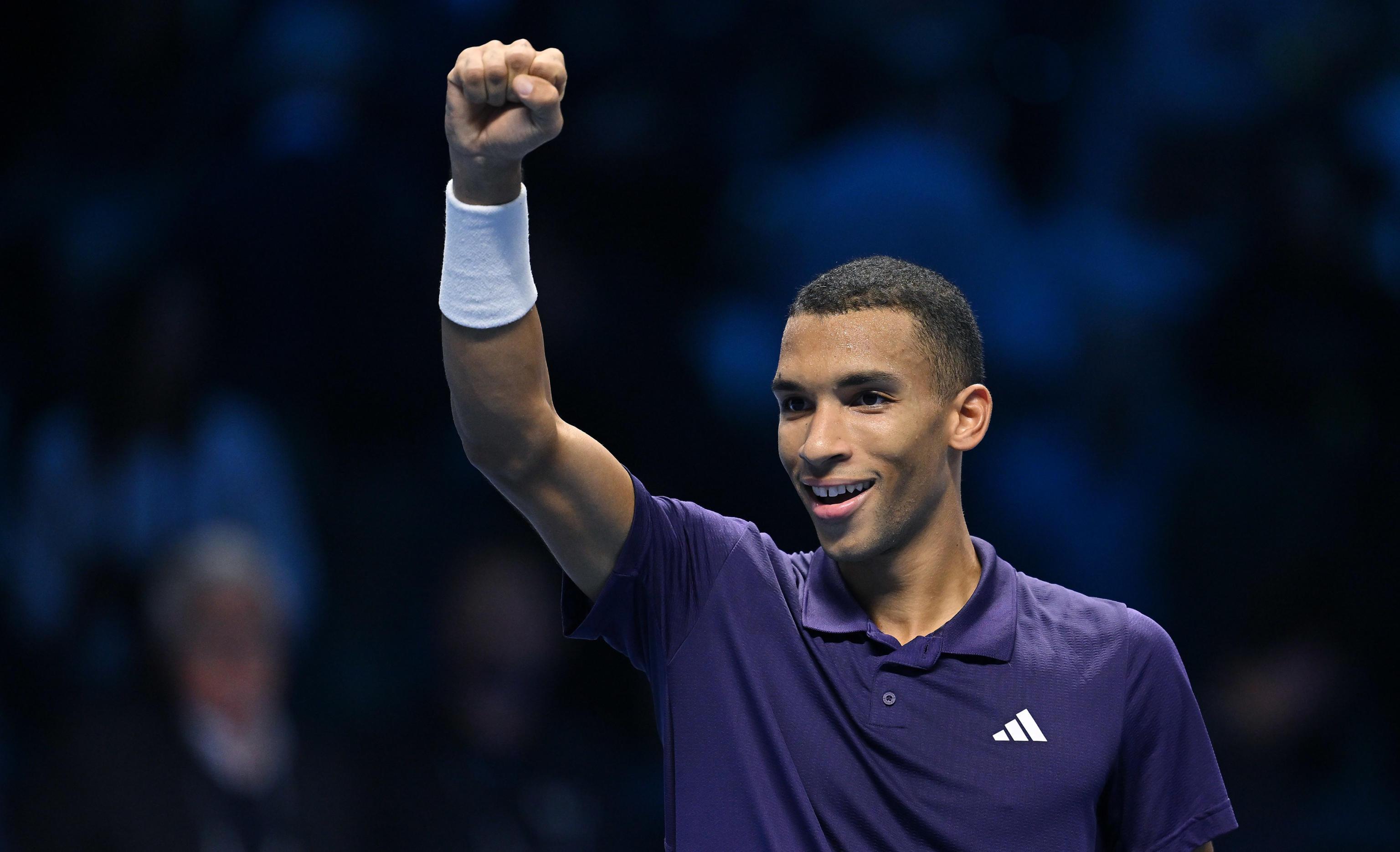 epa12527193 Felix Auger Aliassime of Canada celebrates after his victory against Alexander Zverev of Germany during their Men's Singles Round Robin tennis match at the ATP Finals in Turin, Italy, 14 November 2025.  EPA/ALESSANDRO DI MARCO