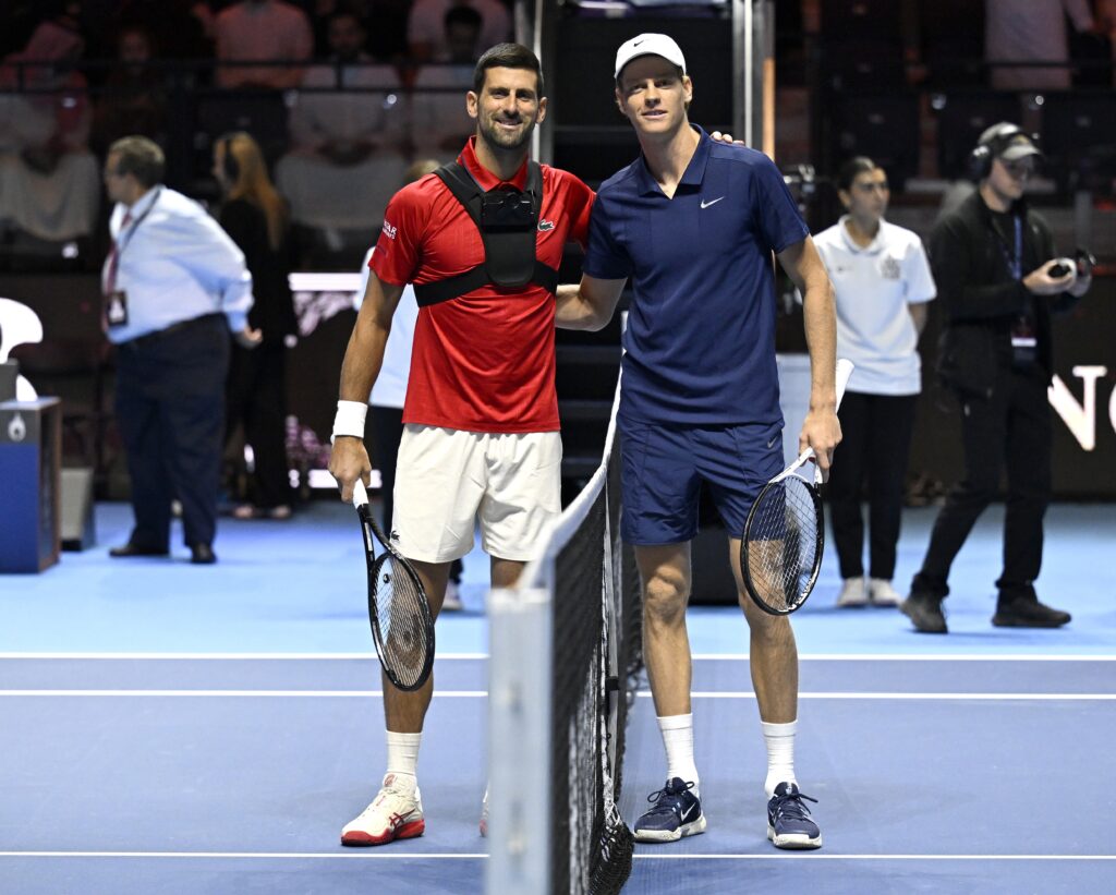 epa12458920 Jannik Sinner (R) of Italy and Novak Djokovic of Serbia pose at the net before their semifinal match at the 2025 Six Kings Slam tennis tournament in Riyadh, Saudi Arabia, 16 October 2025. Sinner won in two sets.  EPA/STR