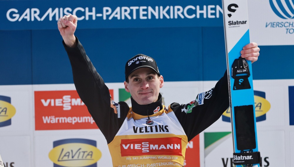 epa12620839 Winner Domen Prevc of Slovenia celebrates on the podium at the Men's Large Hill HS137 competition of the second stage of the 74th Four Hills Tournament, in Garmisch-Partenkirchen, Germany, 01 January 2026.  EPA/ANNA SZILAGYI