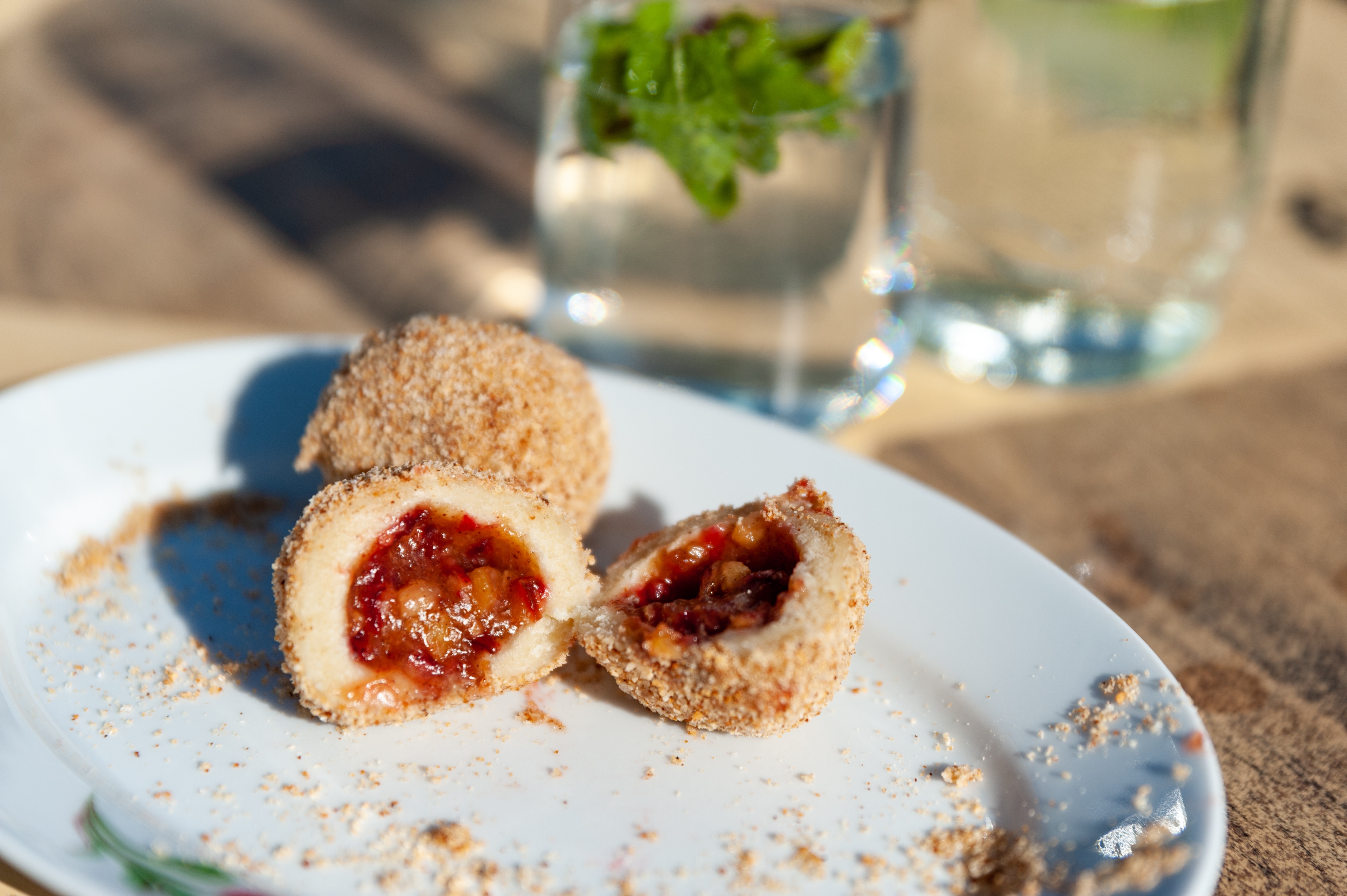 Sweet,Plum,Dumplings,With,A,Glass,Of,Lemonade,Aside