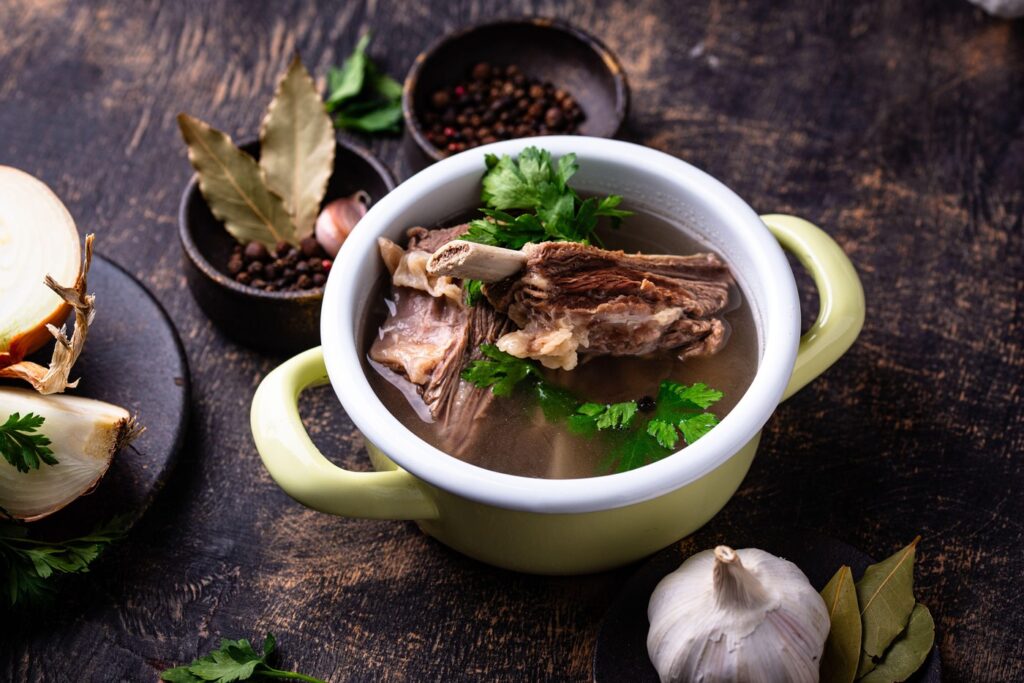 Boiled bone broth or bouillon with meat. Collagen source,Image: 984970396, License: Royalty-free, Restrictions: , Model Release: no, Credit line: Yuliya Furman / Alamy / Profimedia