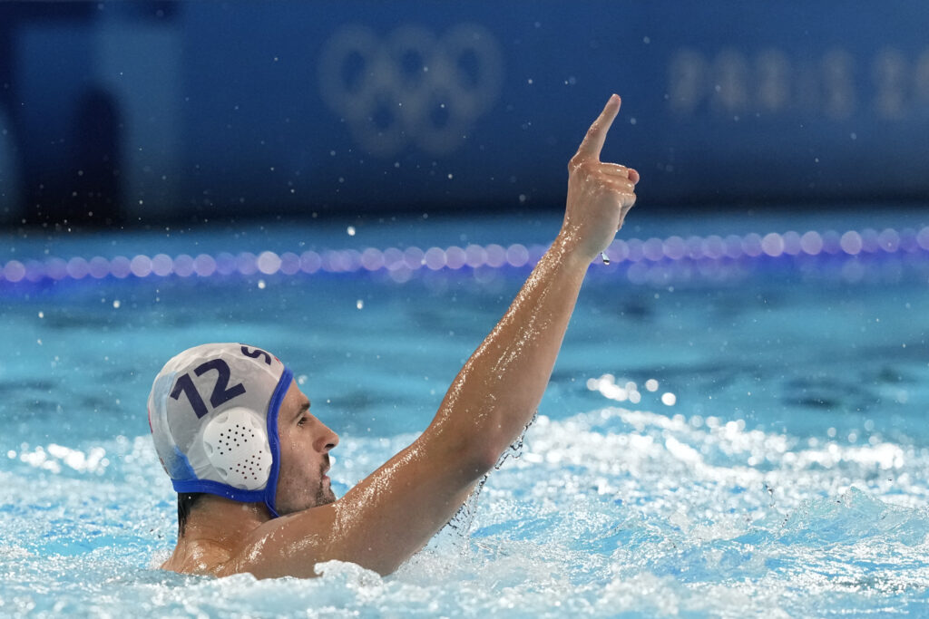 Serbia's Victor Rasovic celebrates after scoring a goal during the men's Water Polo Group B preliminary match between Serbia and Japan at the 2024 Summer Olympics, Sunday, July 28, 2024, in Saint-Denis, France. (AP Photo/Luca Bruno)