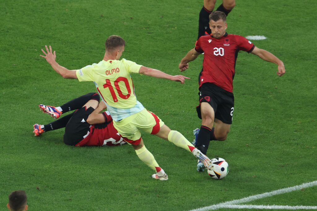 epa11435093 Daniel Olmo (L) of Spain and Ylber Ramadani of Albania in action during the UEFA EURO 2024 group B soccer match between Albania and Spain, in Dusseldorf, Germany, 24 June 2024.  EPA-EFE/GEORGI LICOVSKI