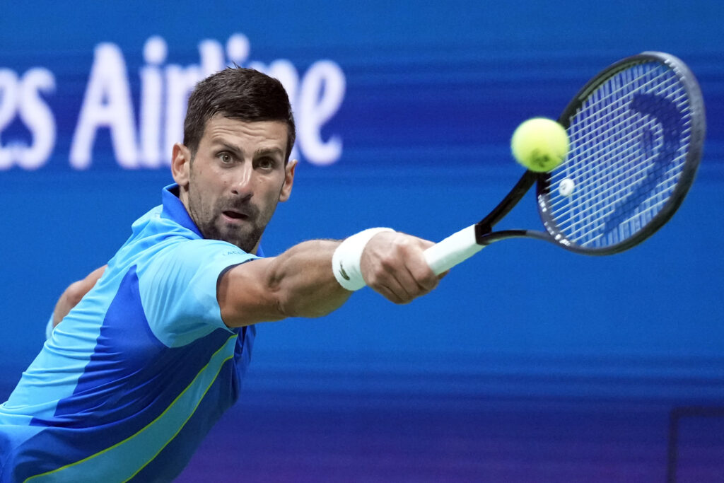 Novak Djokovic, of Serbia, returns to Borna Gojo, of Croatia, during the fourth round of the U.S. Open tennis championships, Sunday, Sept. 3, 2023, in New York. (AP Photo/John Minchillo)