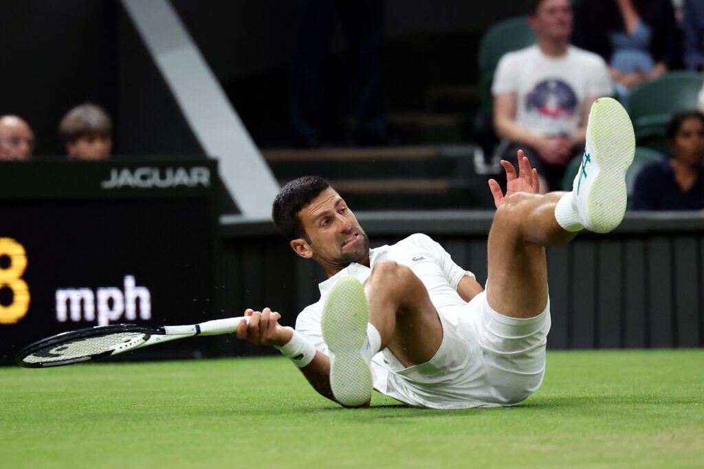 epa10736778 Novak Djokovic of Serbia falls as he plays Hubert Hurkacz of Poland in the Men's Singles 4th round match at the Wimbledon Championships, Wimbledon, Britain, 09 July 2023.  EPA-EFE/ISABEL INFANTES   EDITORIAL USE ONLY