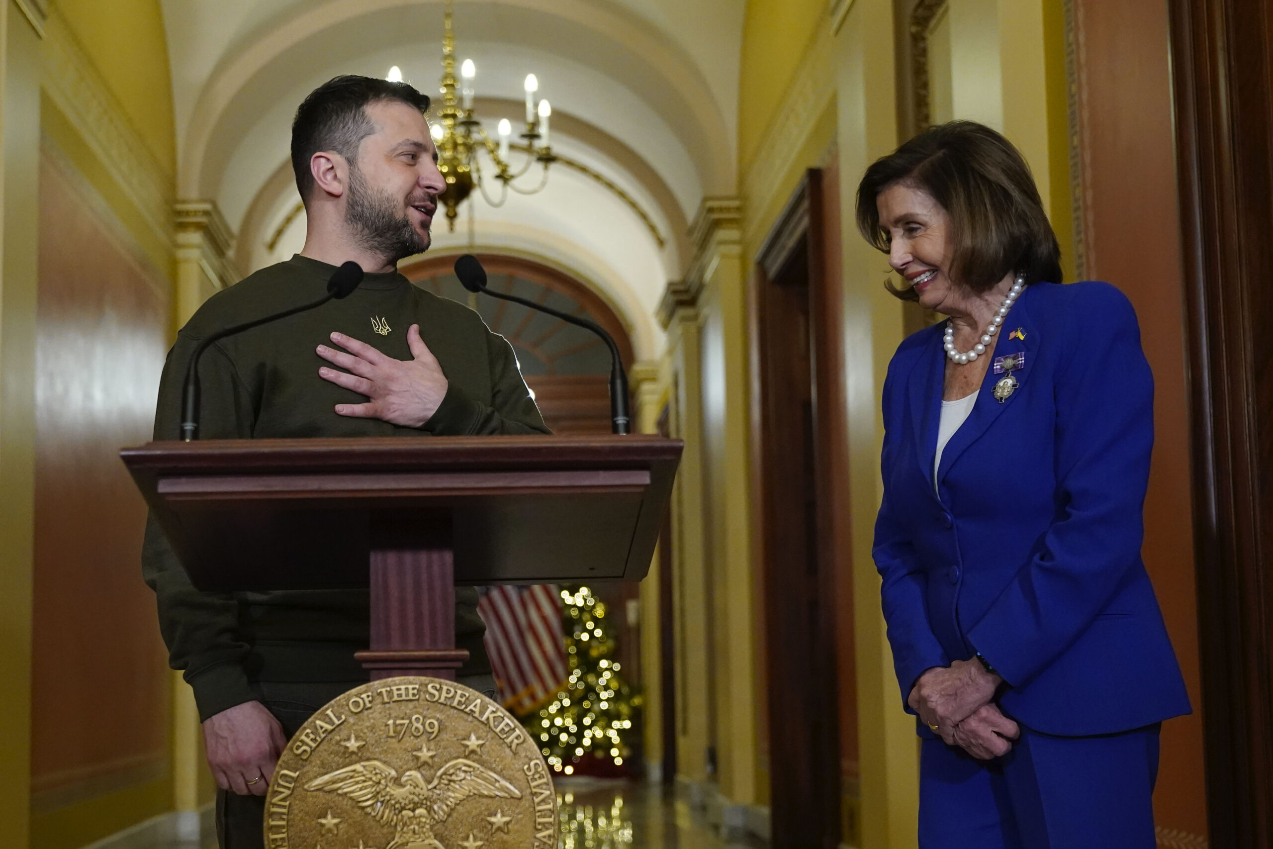 Ukraine's President Volodymyr Zelenskyy, left, meets with Speaker of the House Nancy Pelosi, of Calif., right, Wednesday, Dec. 21, 2022, at the Capitol in Washington. (AP Photo/Jacquelyn Martin)