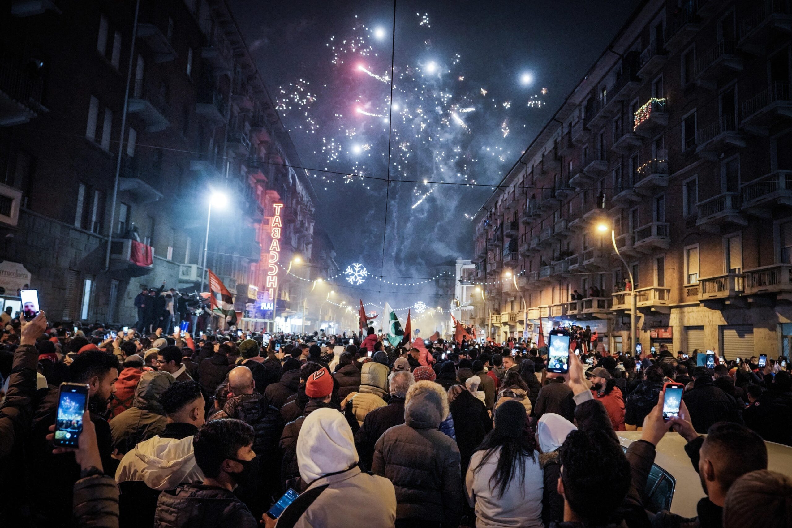 epa10359909 Supporters of Morocco celebrate their team winning the FIFA World Cup 2022 quarter final match between Morocco and Portugal, in Turin, Italy, 10 December 2022.  EPA-EFE/TINO ROMANO ITALY OUT
