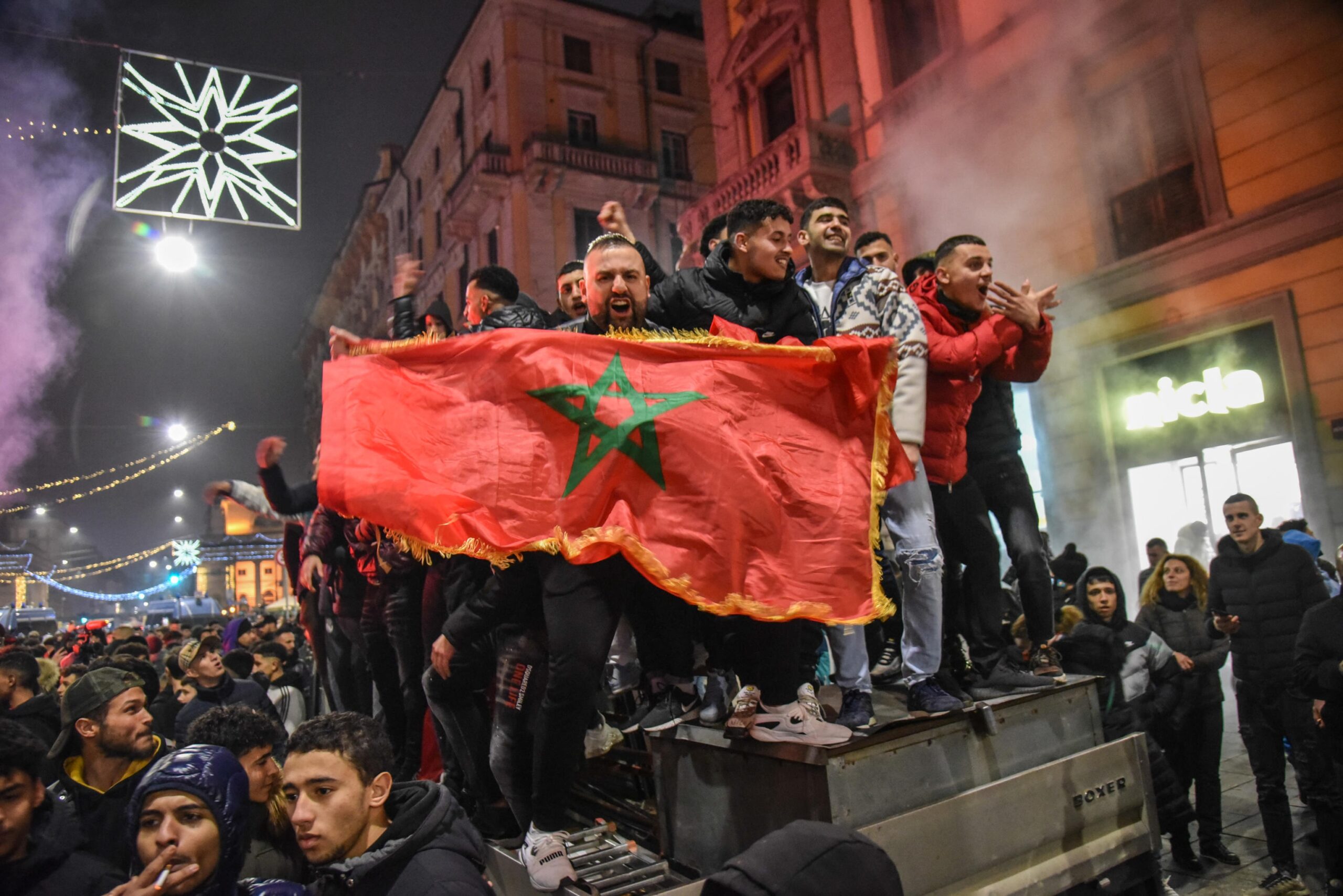 epa10359891 Supporters of Morocco celebrate their team winning the FIFA World Cup 2022 quarter final match between Morocco and Portugal, in Milan, Italy, 10 December 2022.  EPA-EFE/MATTEO CORNER ITALY OUT