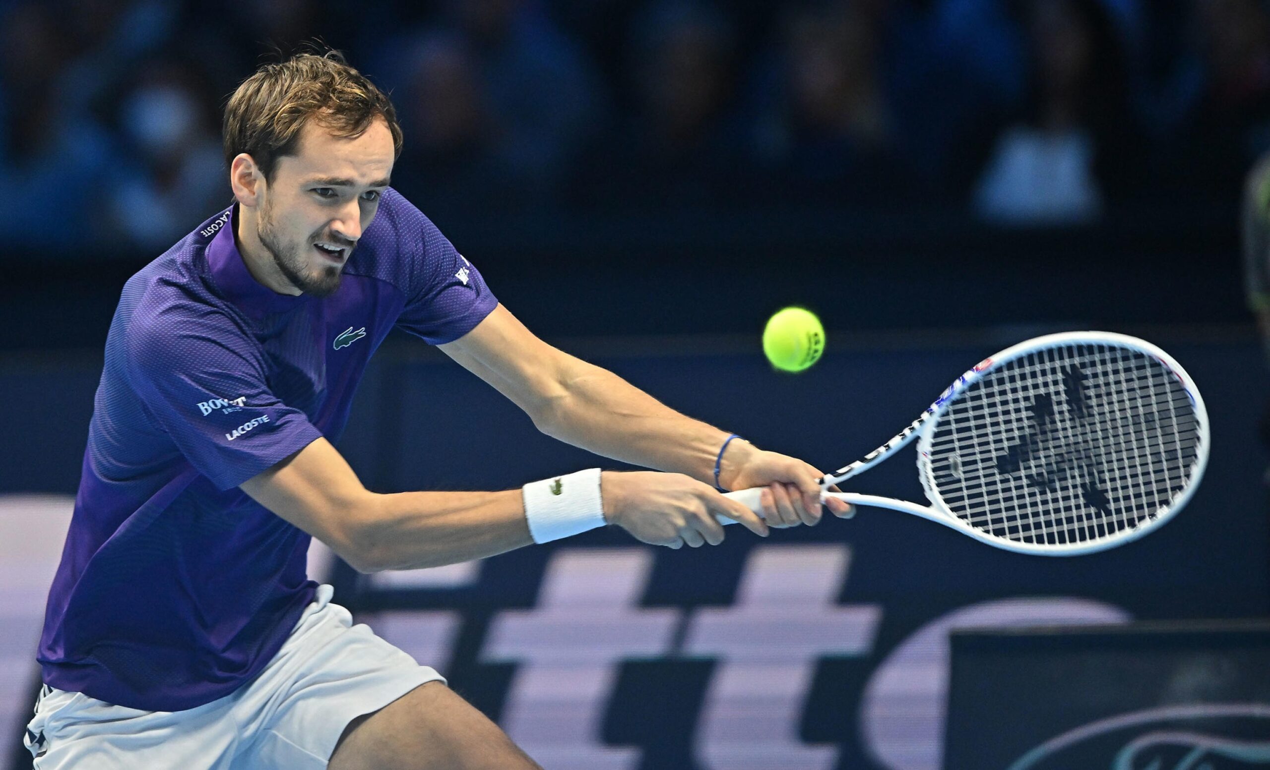 epa10312711 Daniil Medvedev of Russia in action against Novak Djokovic of Serbia during their group match at the Nitto ATP Finals 2022 tennis tournament at the Pala Alpitour arena in Turin, Italy, 18 November 2022.  EPA-EFE/Alessandro Di Marco