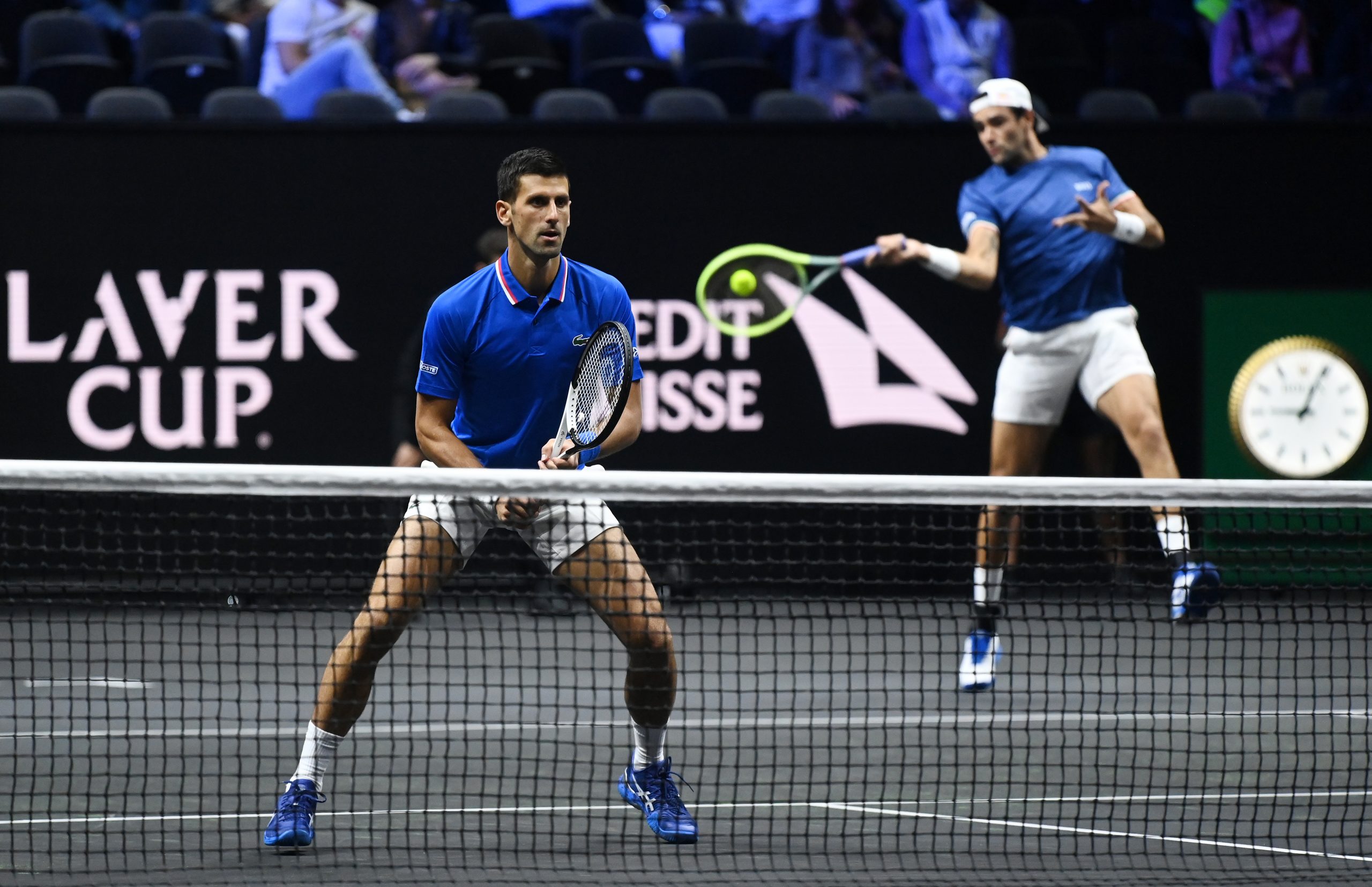 epa10204468 Novak Djokovic of Team Europe (L) with term mate Matteo Berrettini (R) during their Laver Cup doubles match against Alex De Minaur and Jack Sock of Team World at the O2 Arena in London, Britain, 24 September 2022.  EPA-EFE/ANDY RAIN