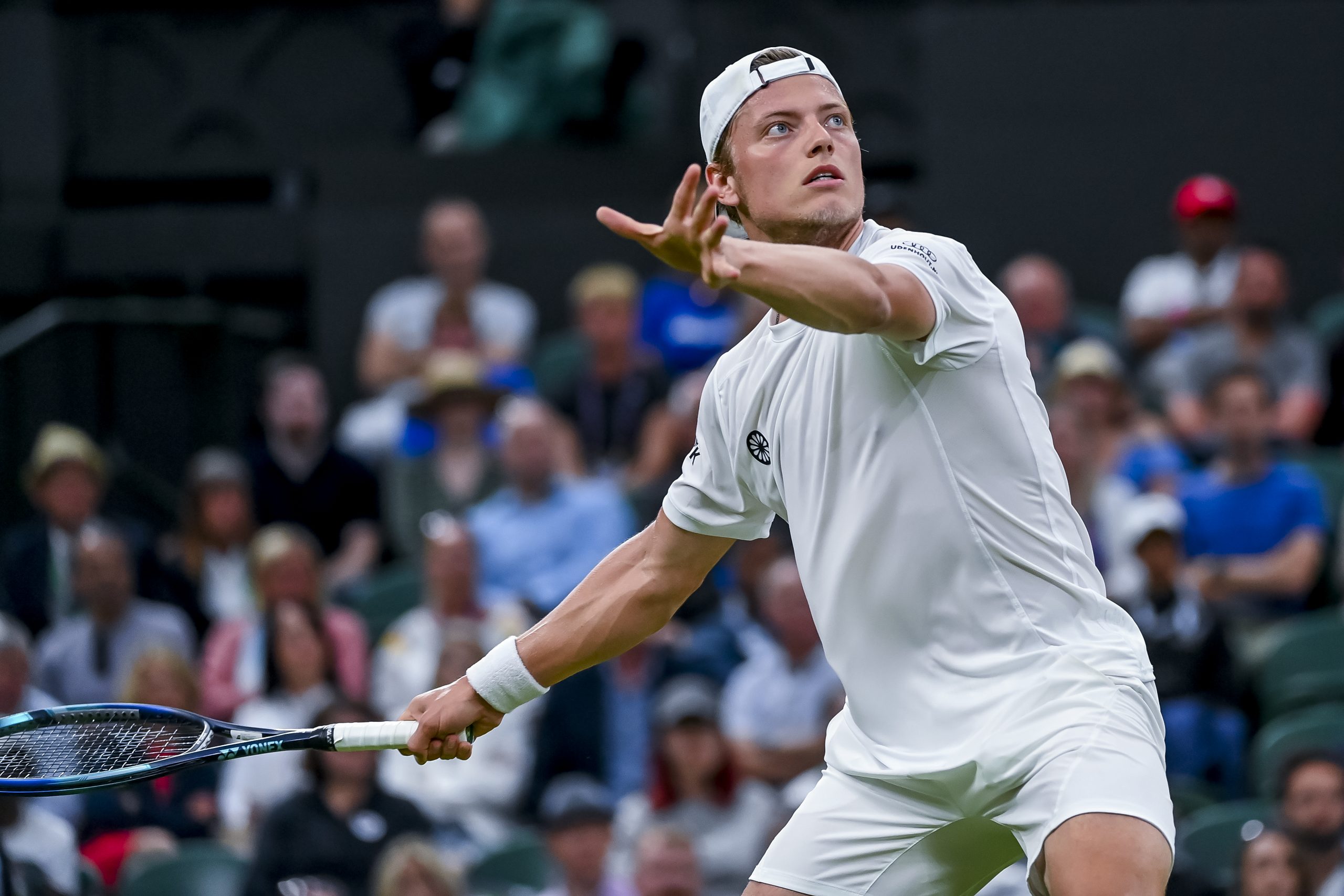 epa10050463 Tim van Rijthoven of the Netherlands in action against Novak Djokovic of Serbia during their Men's fourth round match at the Wimbledon Championships, in Wimbledon, Britain, 03 July 2022.  EPA-EFE/ANDY RAIN   EDITORIAL USE ONLY