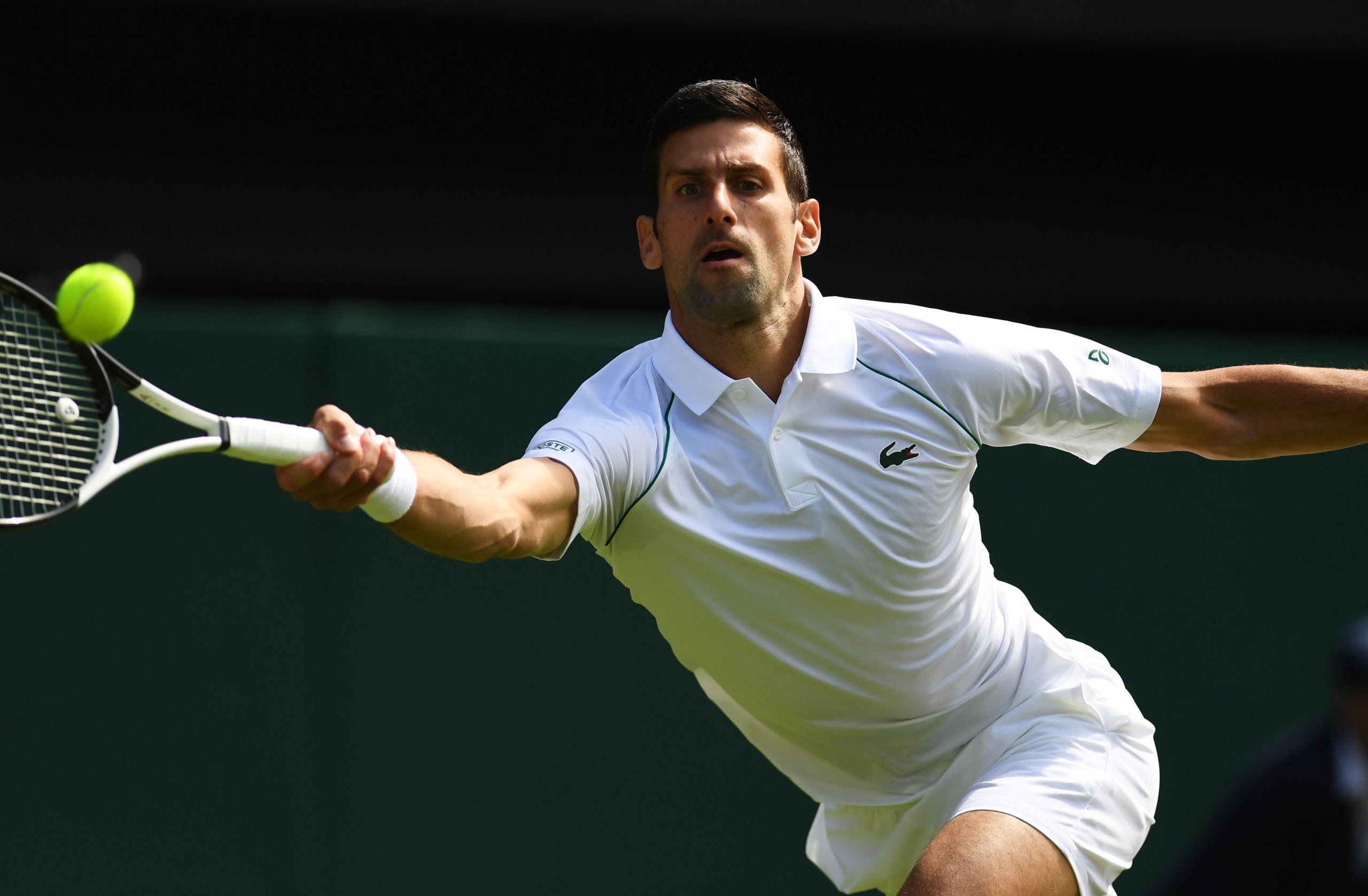 epa10045956 Novak Djokovic of Serbia in action in the men's third round match against Miomir Kecmanovic of Serbia at the Wimbledon Championships, in Wimbledon, Britain, 01 July 2022.  EPA-EFE/NEIL HALL   EDITORIAL USE ONLY