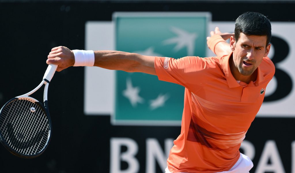 epa09938159 Novak Djokovic of Serbia in action during his men's singles second round match against Aslan Karatsev of Russia at the Italian Open tennis tournament in Rome, Italy, 10 May 2022.  EPA-EFE/ETTORE FERRARI