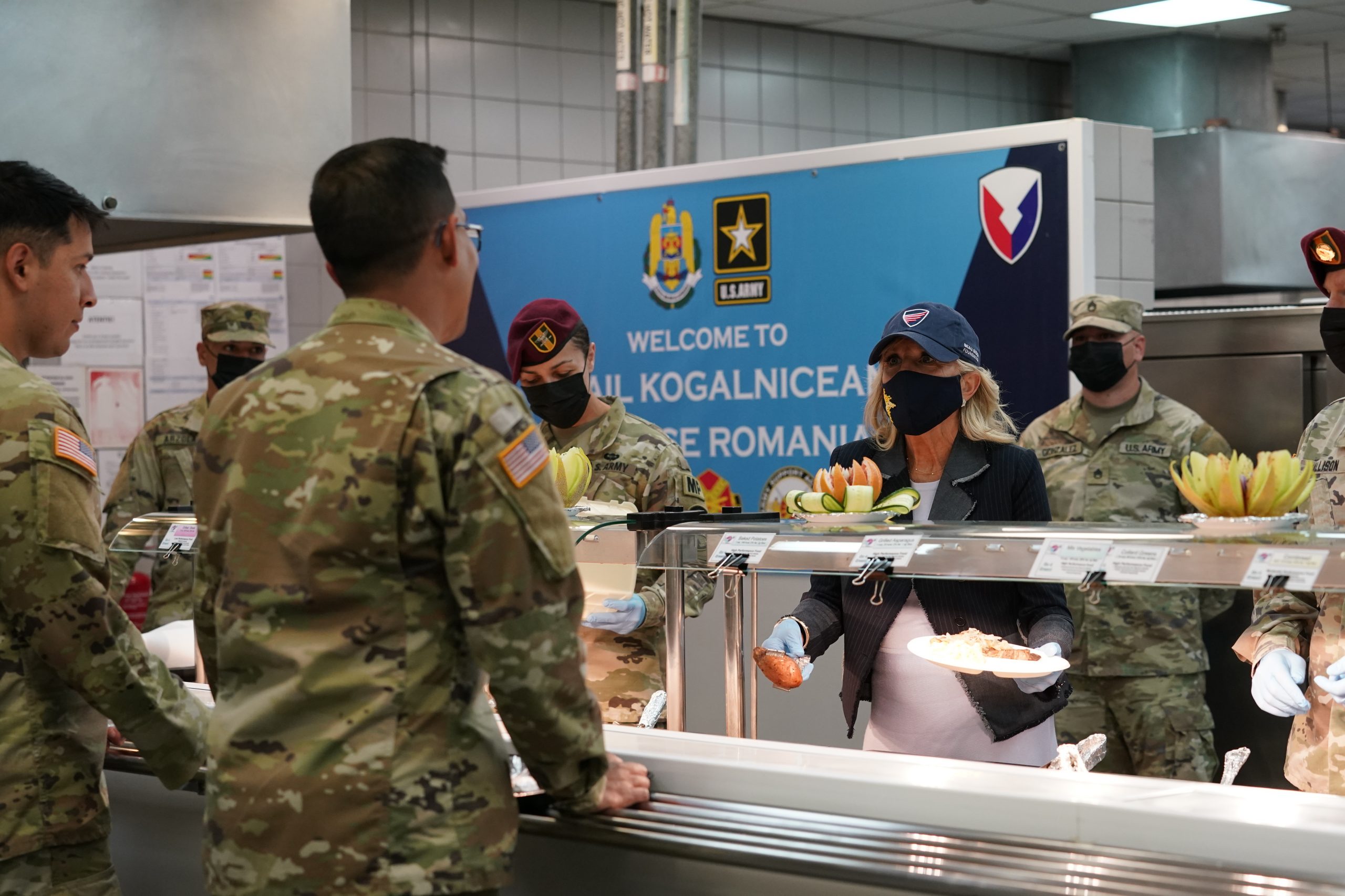 First lady Jill Biden serves meals to U.S. troops during a visit to the Mihail Kogalniceanu Air Base in Romania, Friday, May 6, 2022. (AP Photo/Susan Walsh, Pool)