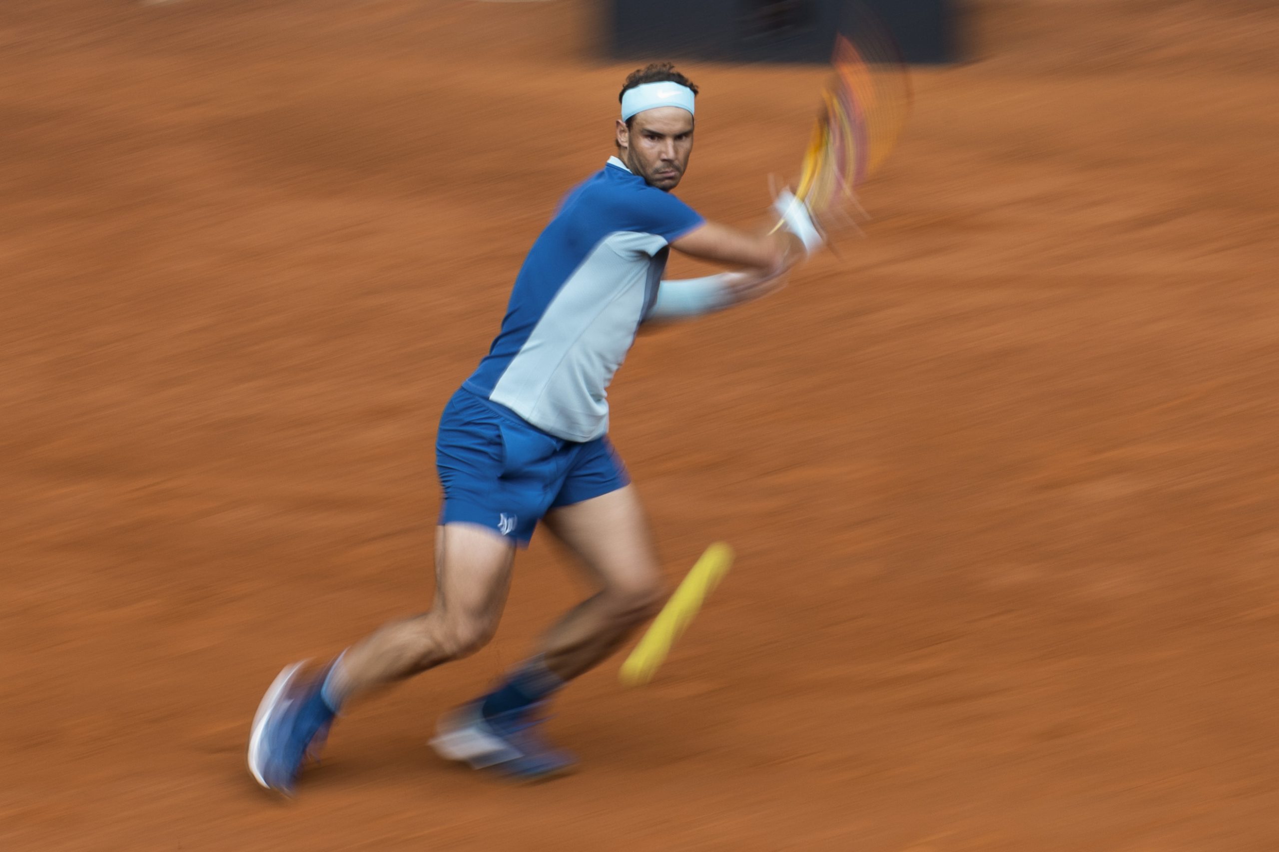 epa09926465 Rafa Nadal of Spain in action during his men's singles round of 32 match against Miomir Kecmanovic of Serbia at the Mutua Madrid Open tennis tournament at the Caja Magica in Madrid, Spain, 04 May 2022.  EPA-EFE/Rodrigo Jimenez