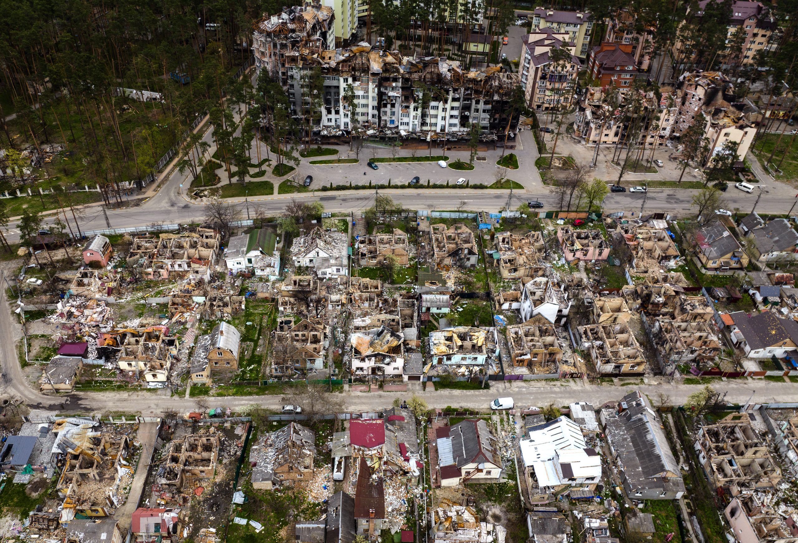 Destroyed houses are photographed in Irpin, on the outskirts of Kyiv, Ukraine, Saturday, April 30, 2022. (AP Photo/Emilio Morenatti)