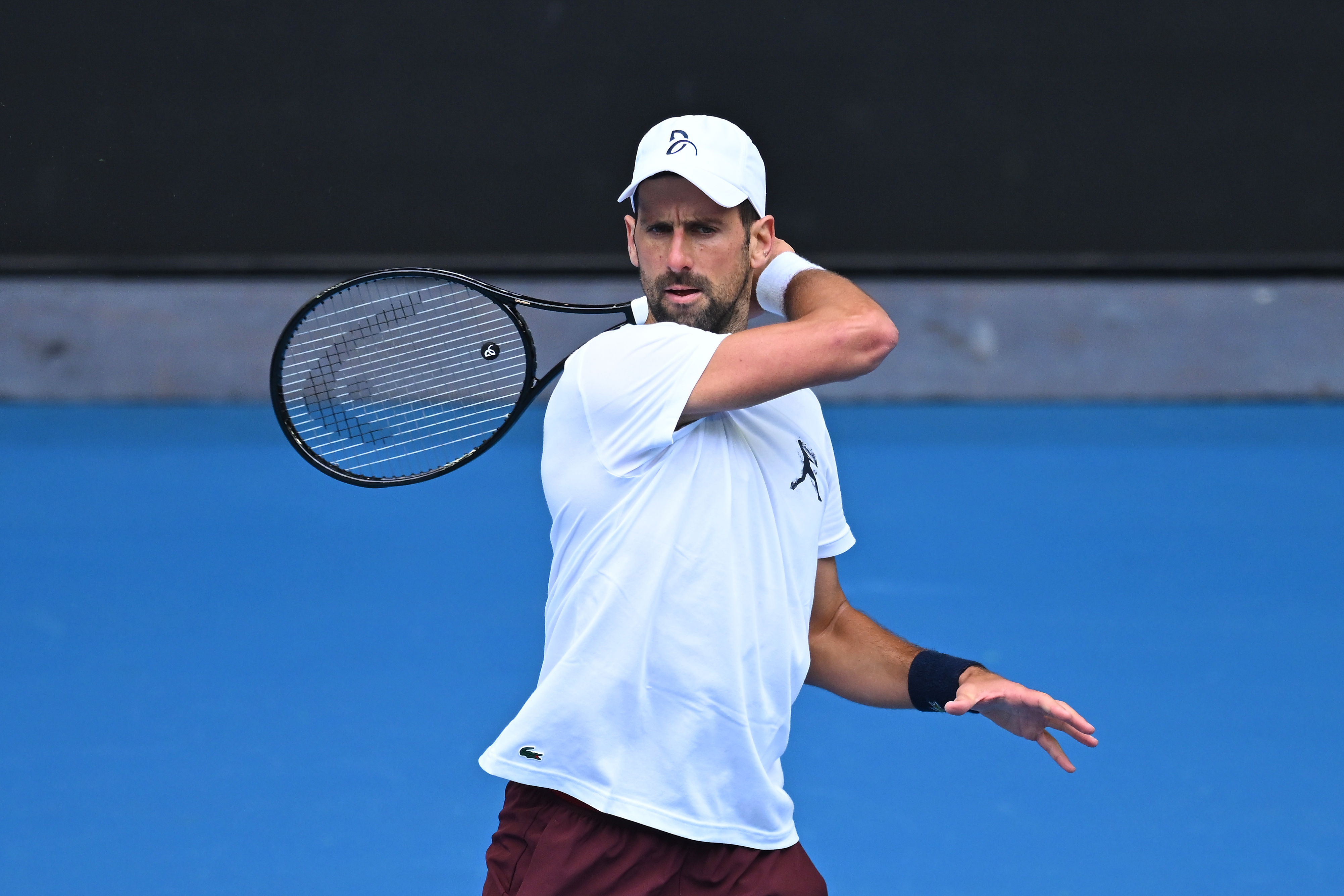 epa12645717 Novak Djokovic of Serbia practices ahead of the Australian Open tennis tournament at Melbourne Park in Melbourne, Australia, 13 January 2026.  EPA/JAMES ROSS AUSTRALIA AND NEW ZEALAND OUT