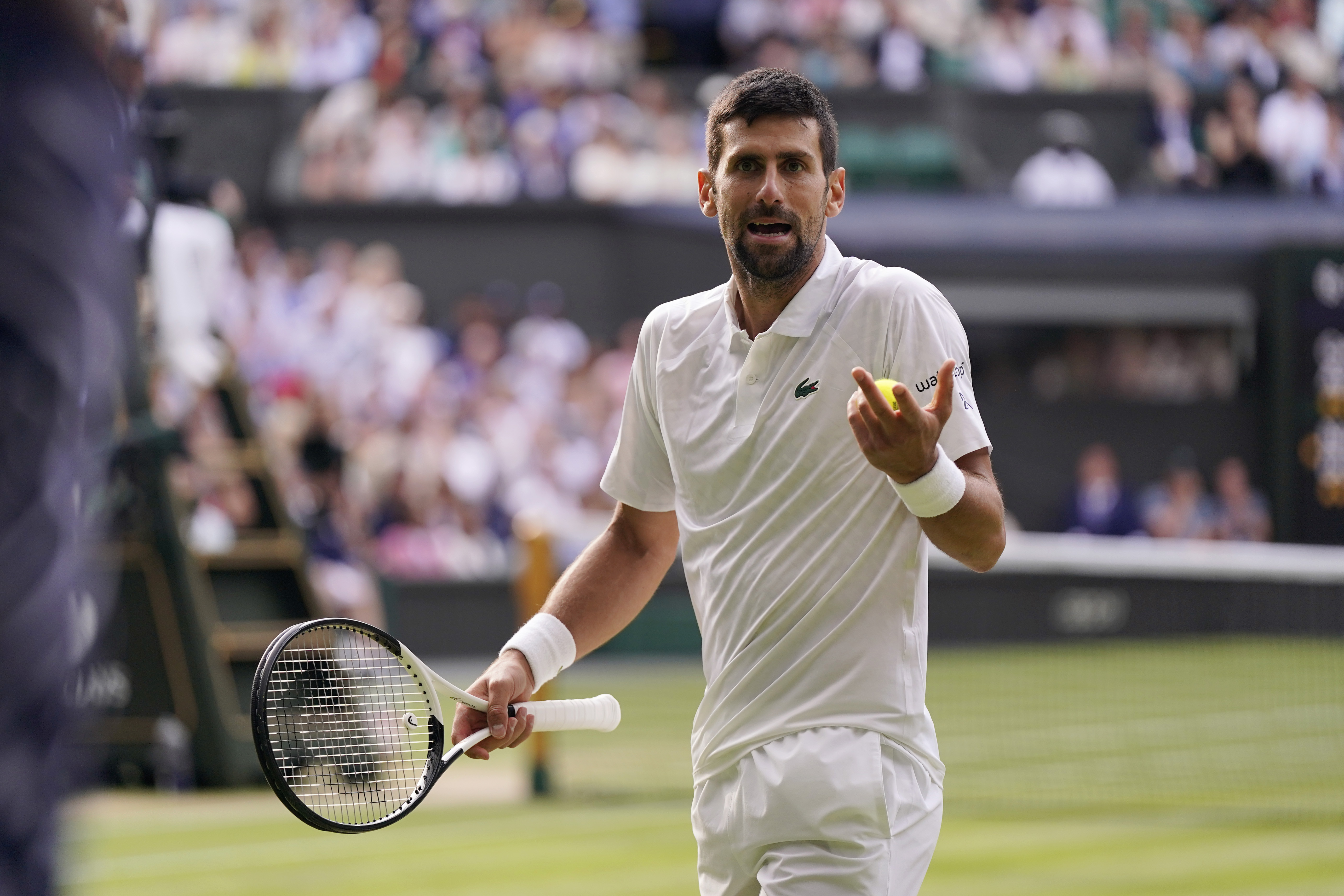 Serbia's Novak Djokovic reacts after losing a point against Spain's Carlos Alcaraz during the men's singles final on day fourteen of the Wimbledon tennis championships in London, Sunday, July 16, 2023. (AP Photo/Alberto Pezzali)