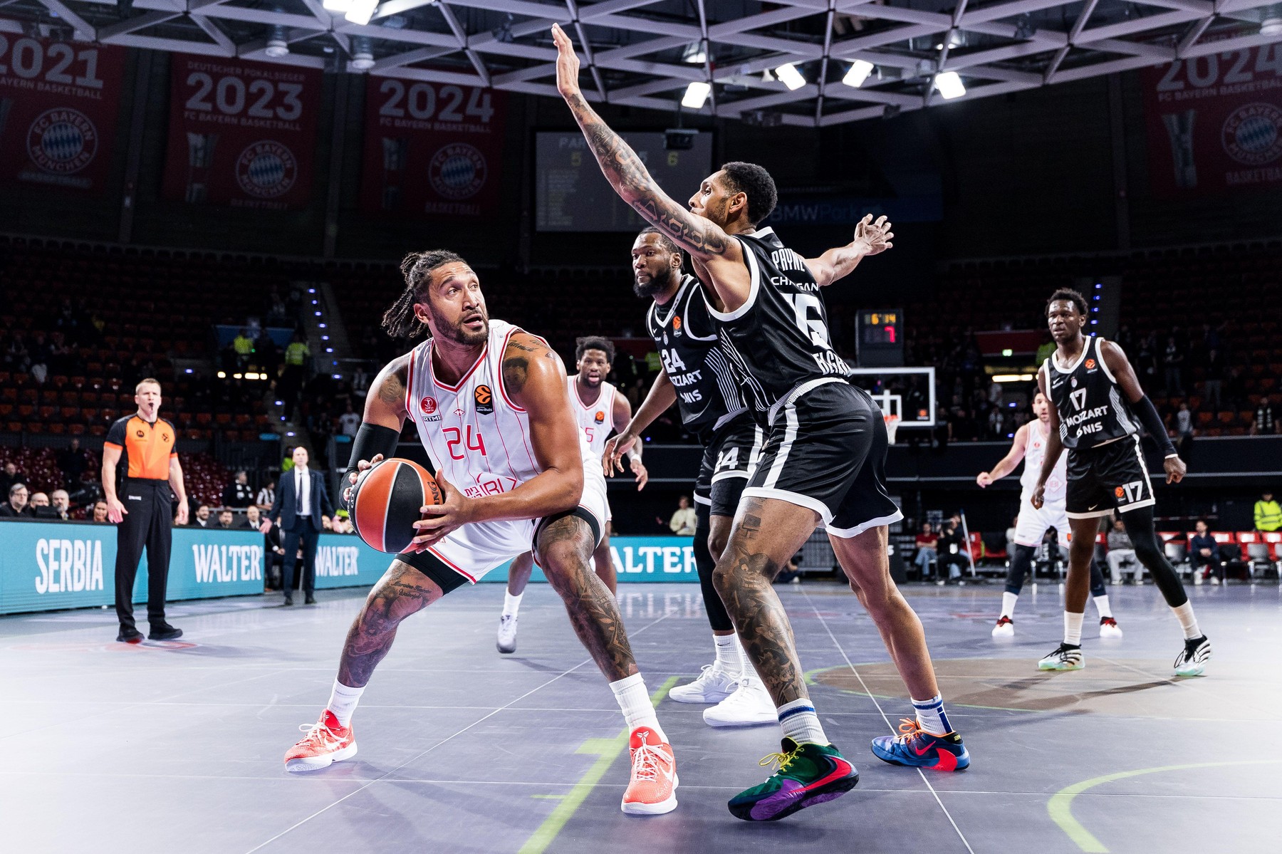 MUNICH, GERMANY - JANUARY 23: Ish Wainright (Hapoel IBI Tel Aviv, 24) controls the ball against Cameron Payne (Partizan Mozzart Bet Belgrade, 15) during the Turkish Airlines EuroLeague match between Partizan Mozzart Bet Belgrade vs. Hapoel IBI Tel Aviv at