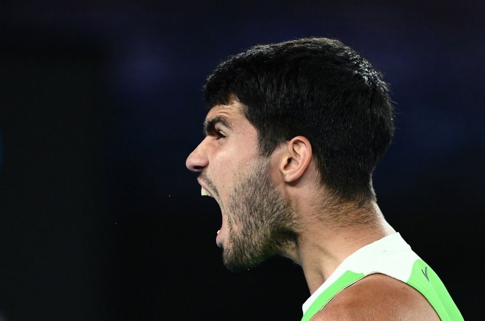 epa12684590 Carlos Alcaraz of Spain celebrates winning his Men's Singles quarter-finals match against Alex de Minaur of Australia at the Australian Open tennnis tournament in Melbourne, 27 January 2026.  EPA/JOEL CARRETT  AUSTRALIA AND NEW ZEALAND OUT