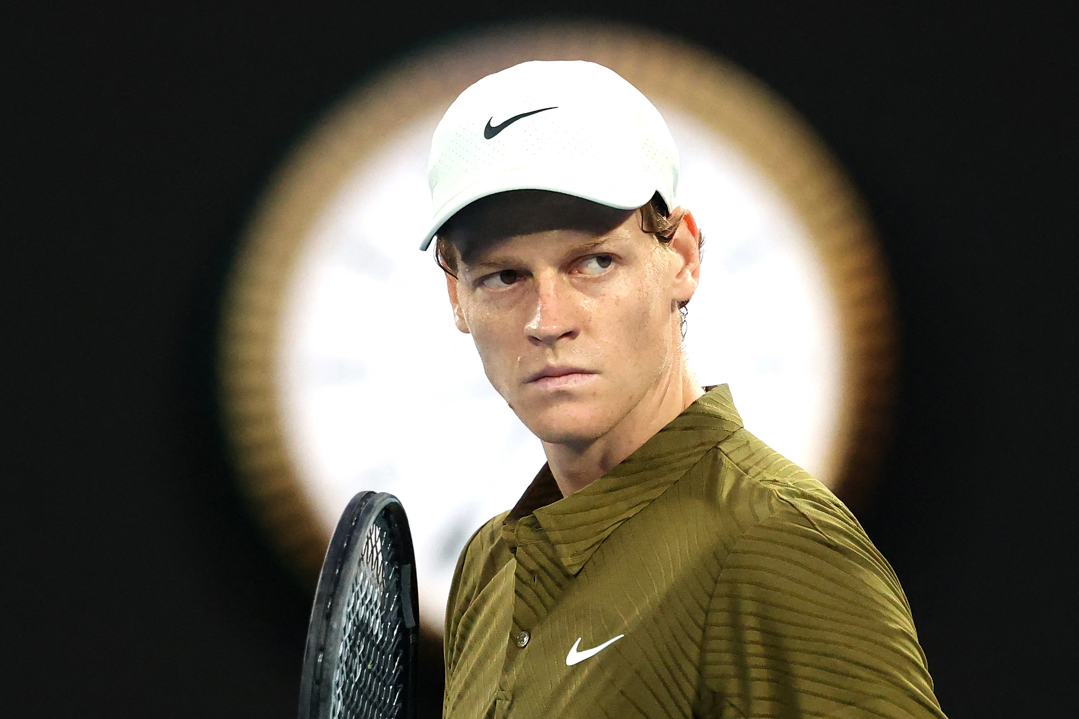 Italy's Jannik Sinner reacts on a point to USA's Ben Shelton during their men's singles quarter-final match on day eleven of the Australian Open tennis tournament in Melbourne on January 28, 2026.
