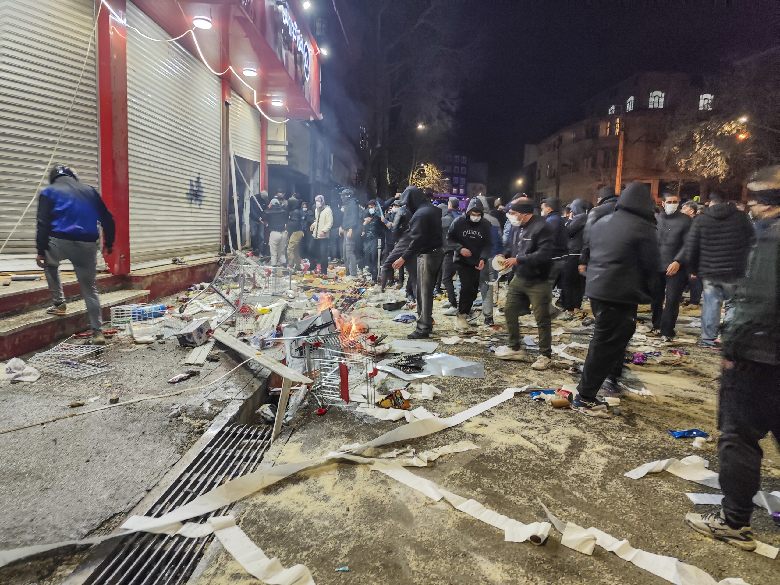 Iranians gather while blocking a street during a protest in Kermanshah, Iran on January 8