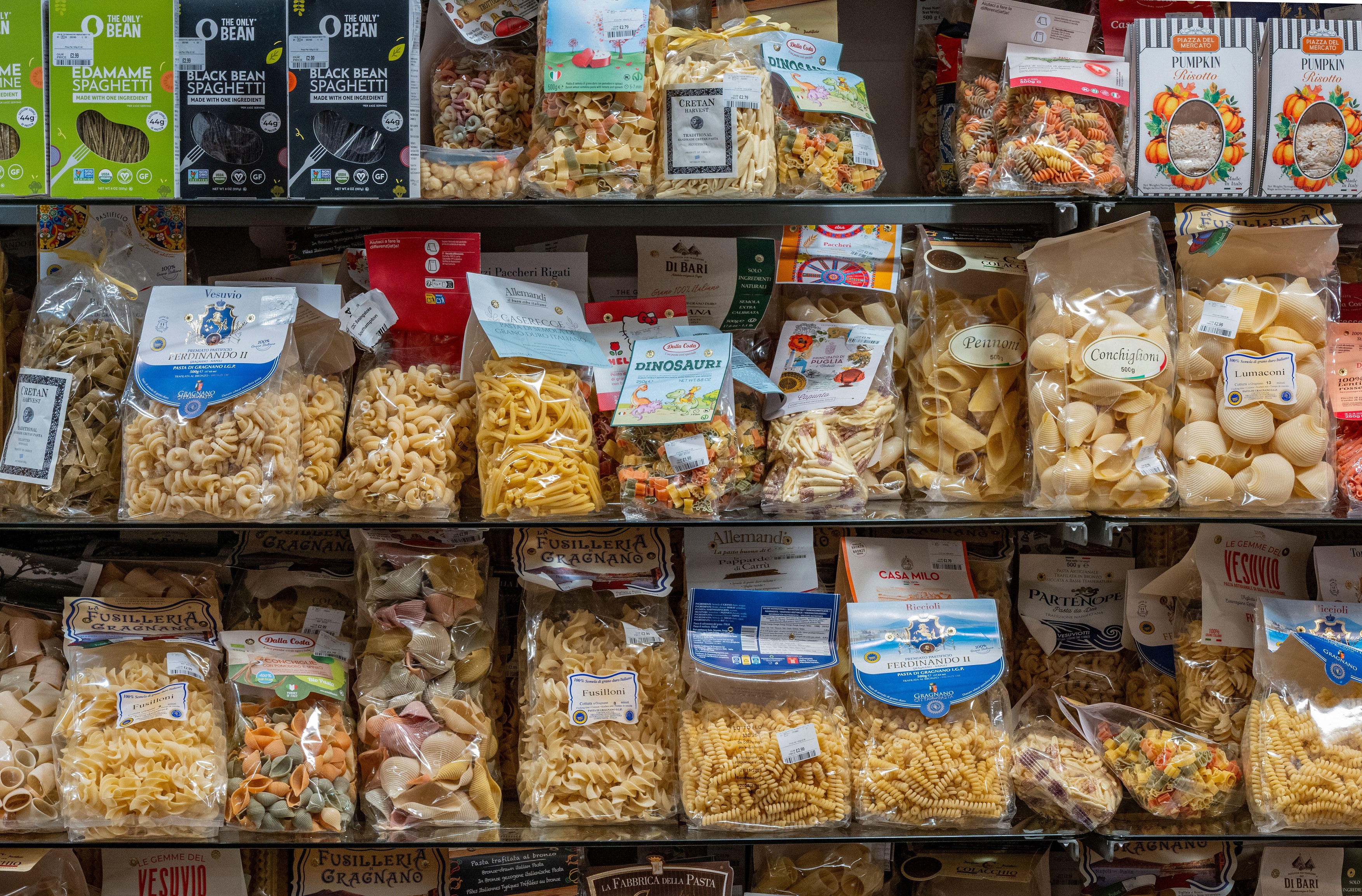 a selection of multi-coloured and variety of shapes and sizes of pasta