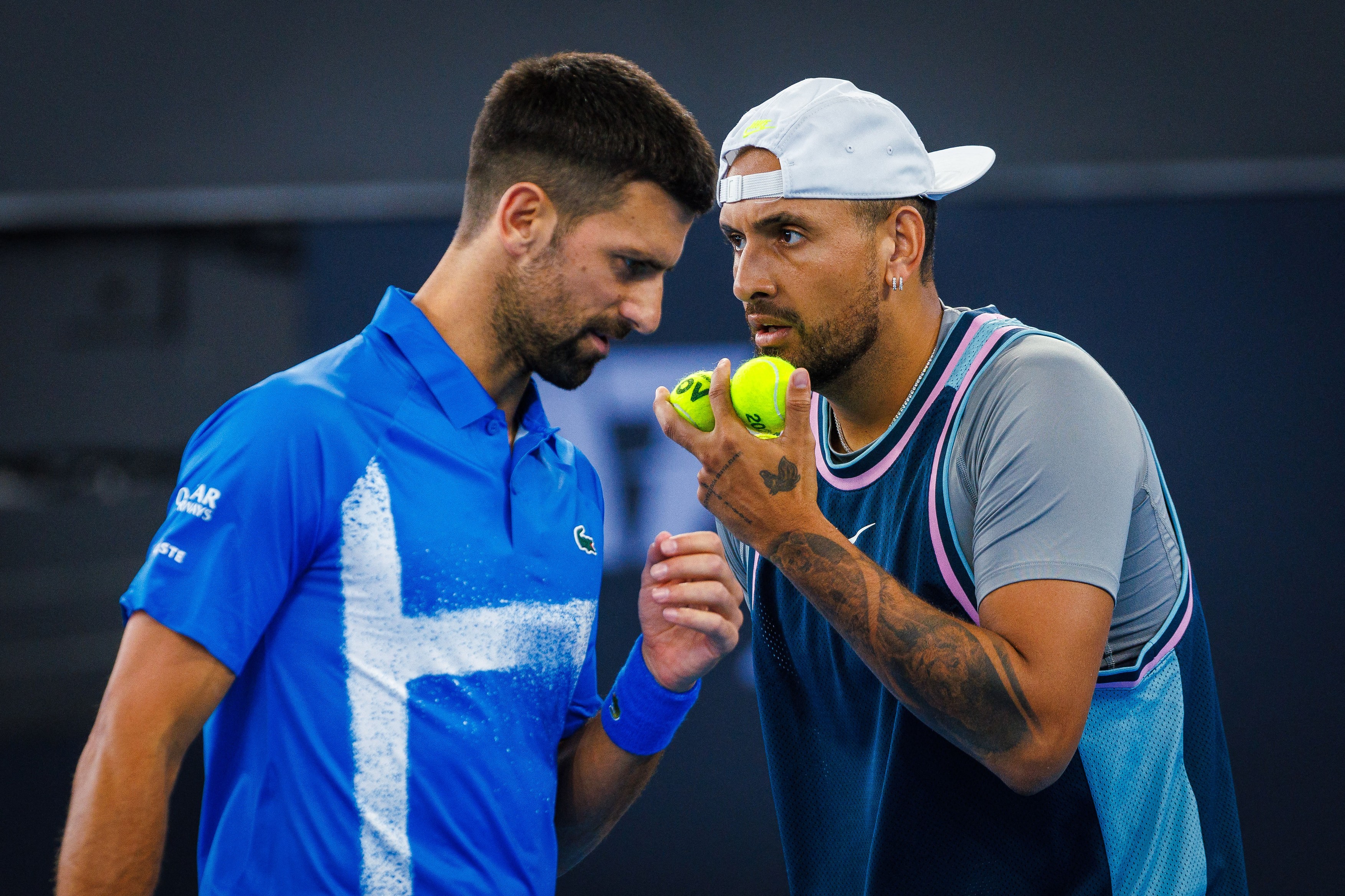 Novak Djokovic of Serbia (L) and Nick Kyrgios of Australia