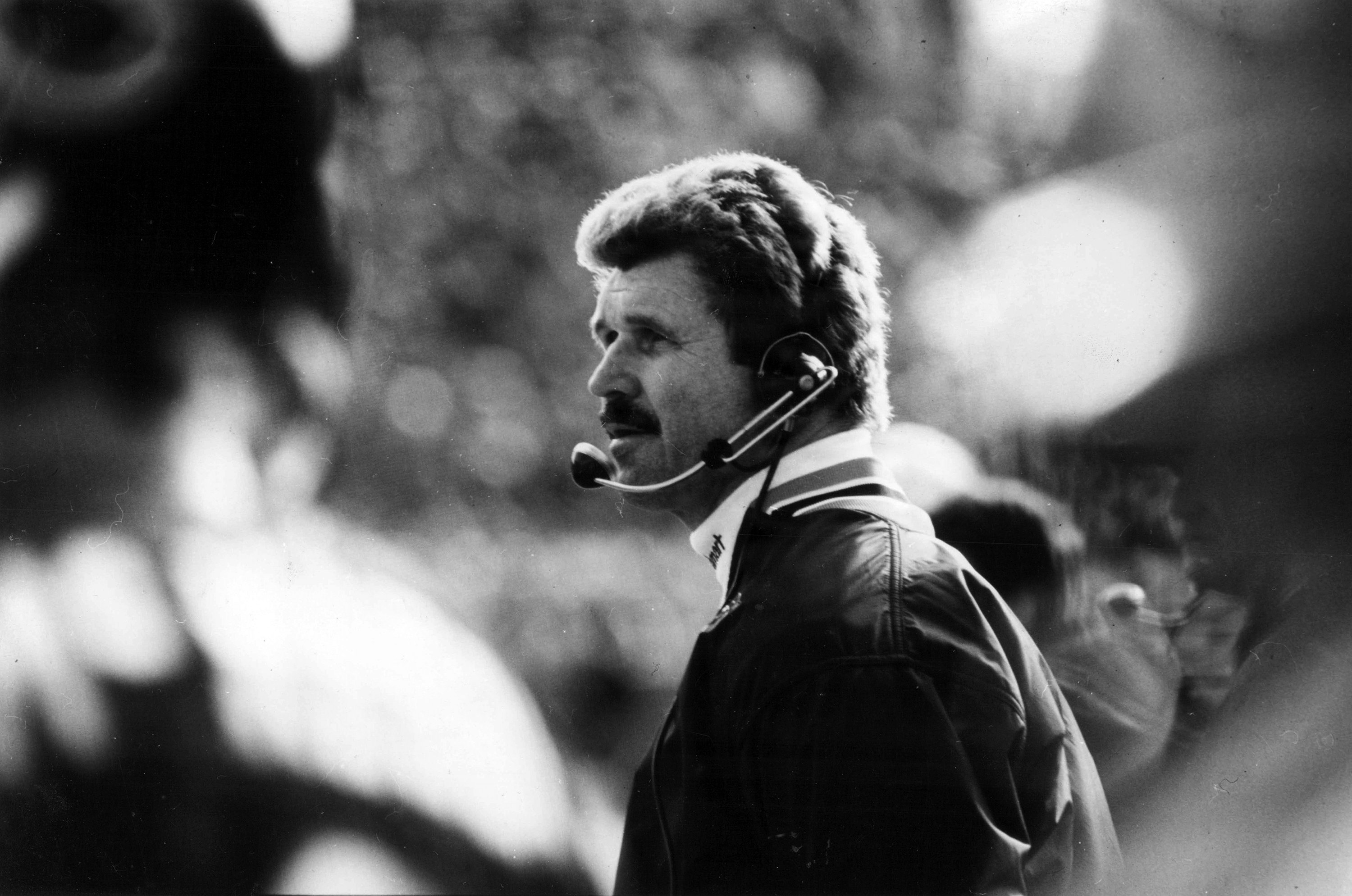 Chicago Bears head coach Mike Ditka watches from the sideline wearing a headset during a National Football League (NFL) game in November 1982.