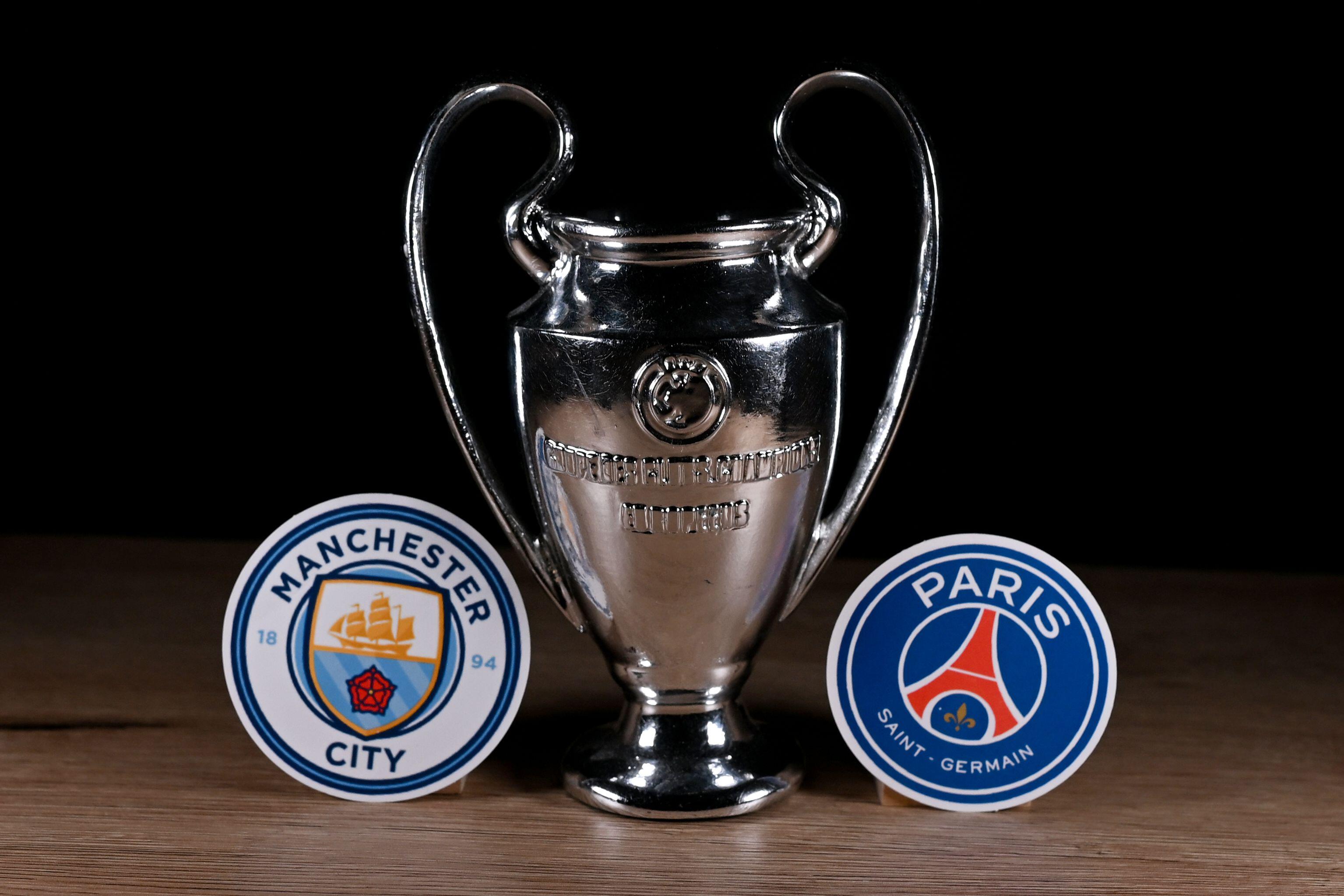 Emblems of football clubs participating in the group stage of the UEFA Champions League: Manchester City and Paris Saint‑Germain.