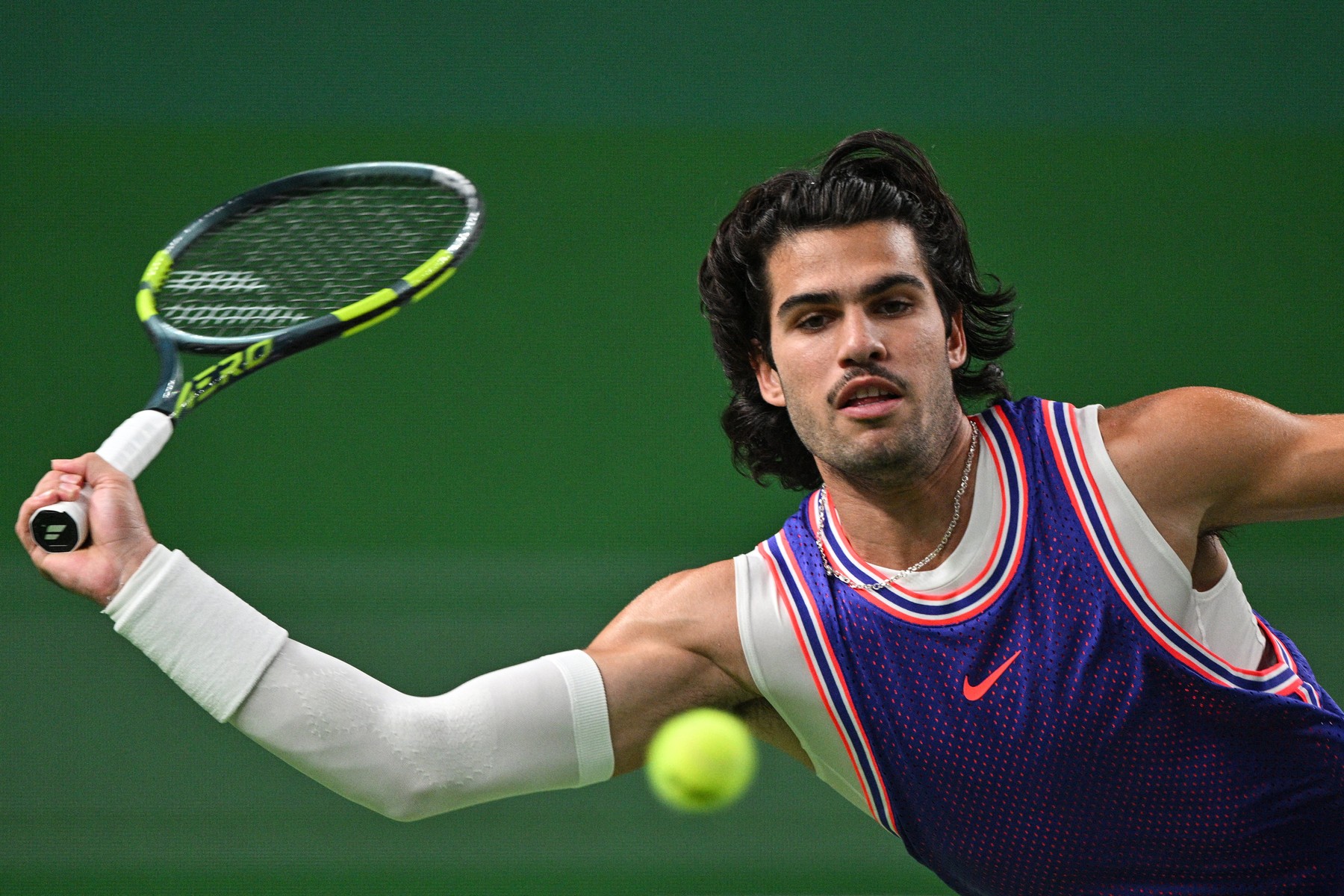 Spain's Carlos Alcaraz hits a return to Belgium's Zizou Bergs their men's