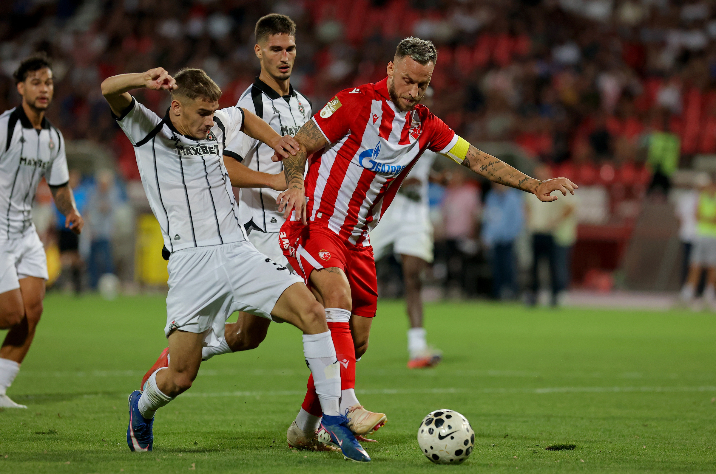 Stefan Petrovic of Partizan (L) in action against Marko Arnautovic of Crvena Zvezda (R)